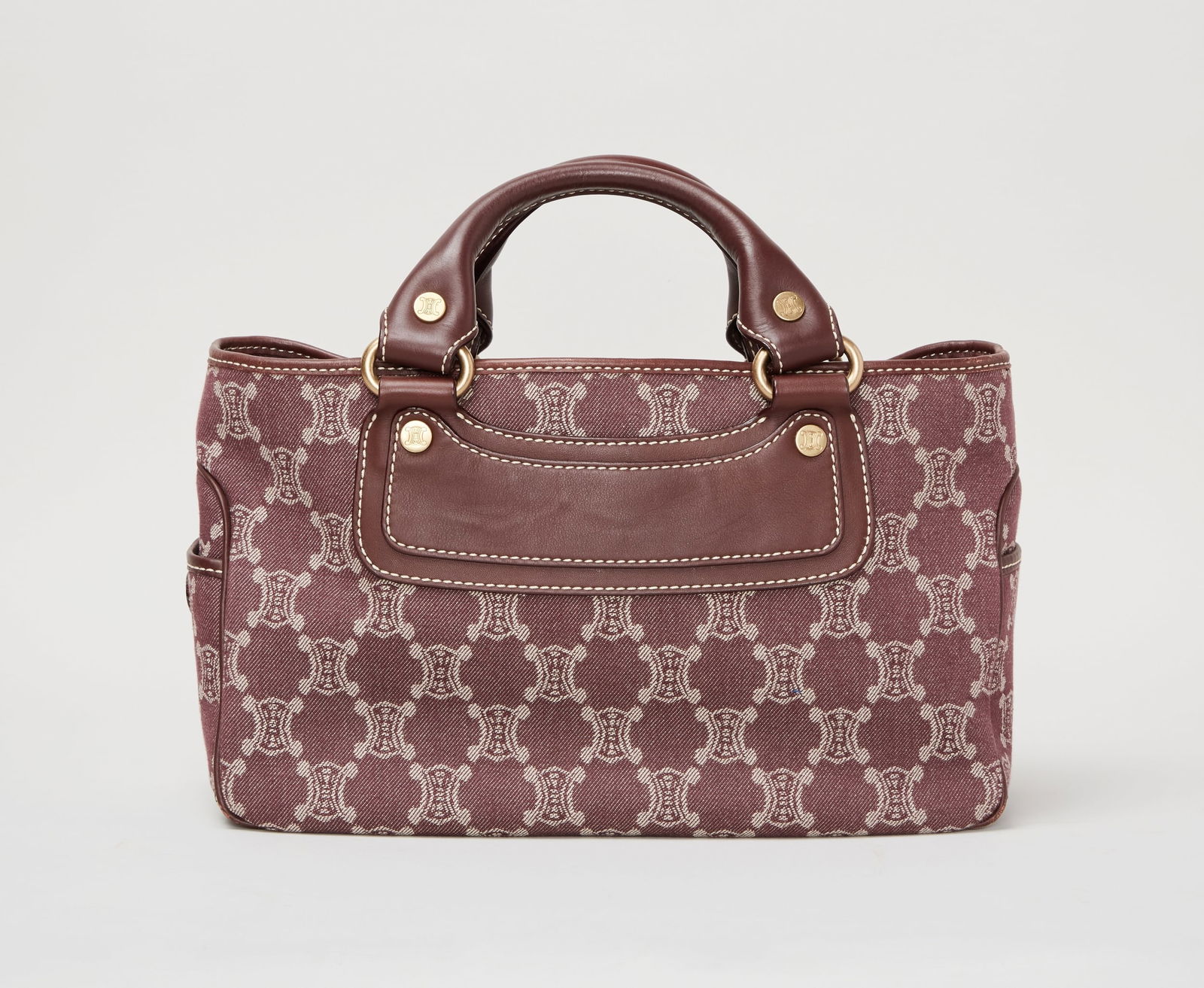 Celine | 2000s Macadam Boogie Canvas Tote Bag: Celine 2000s Macadam Boogie canvas tote bag.A structured top handled bag crafted in burgundy cotton jacquard canvas with an all-over tonal geometric logo pattern, trimmed in burgundy leather with