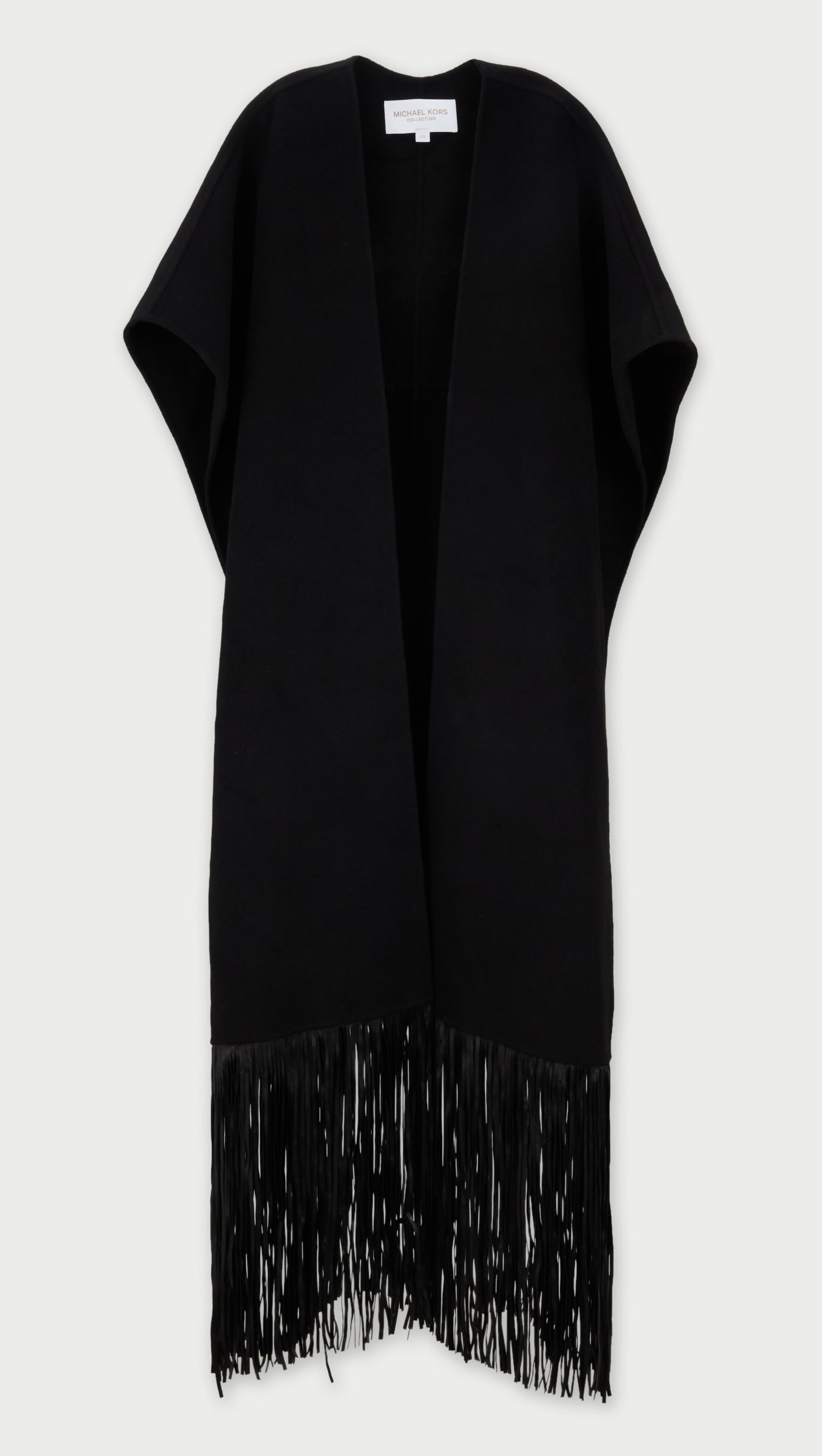 Michael Kors Collection | Wool Cape with Leather Fringe: This is a Michael Kors cape with leather fringe that drapes over the shoulders with a wrap style front, from the collection of Cameron Silver.A long black wool blend cape with leather fringe trim on