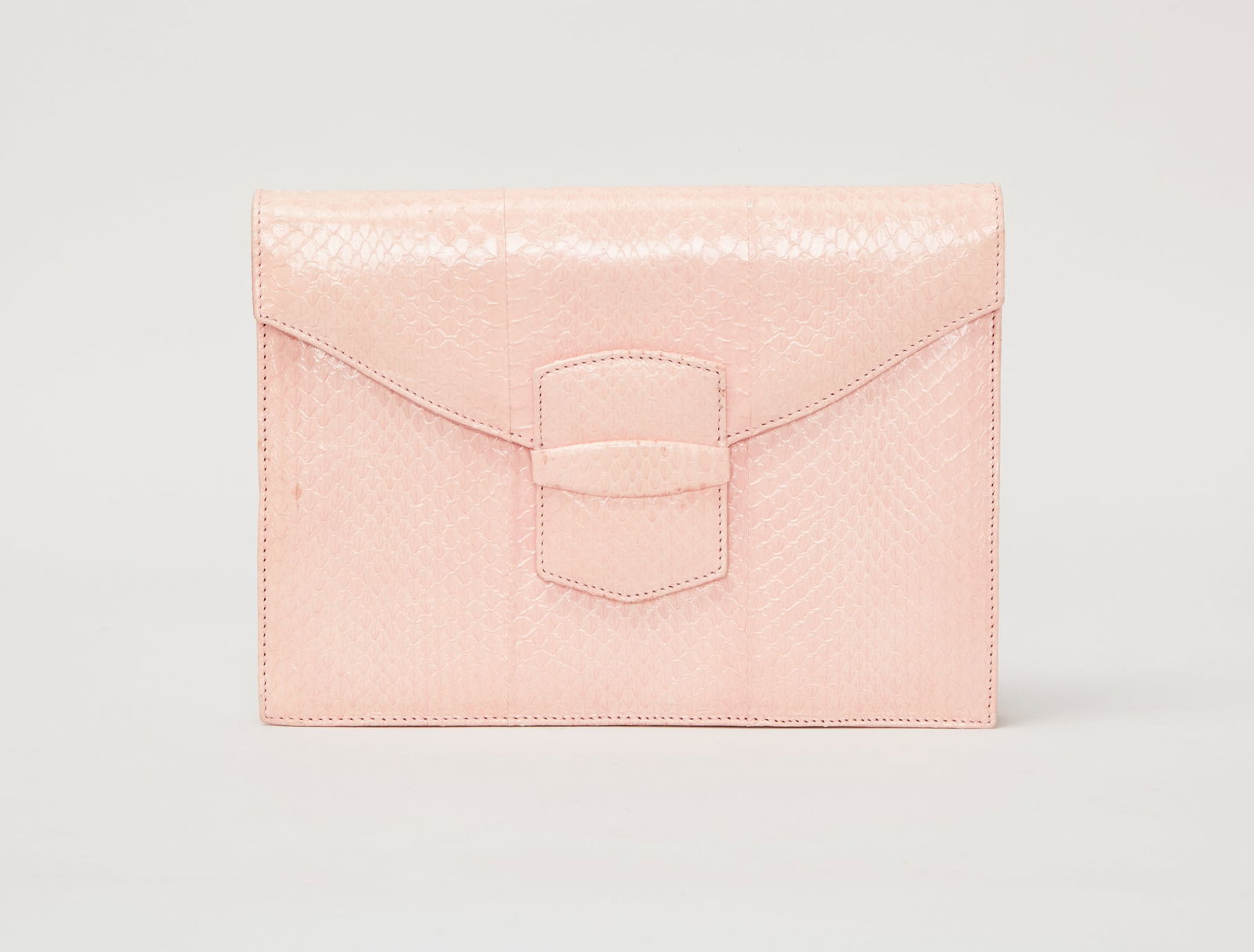 Oscar de la Renta | Pink Snakeskin Envelope Clutch: Oscar de la Renta pink flat snakeskin envelope clutch.The clutch opens with a hidden magnetic closure. The interior is lined in pink suede and features a single flat pocket with an Oscar de la Renta