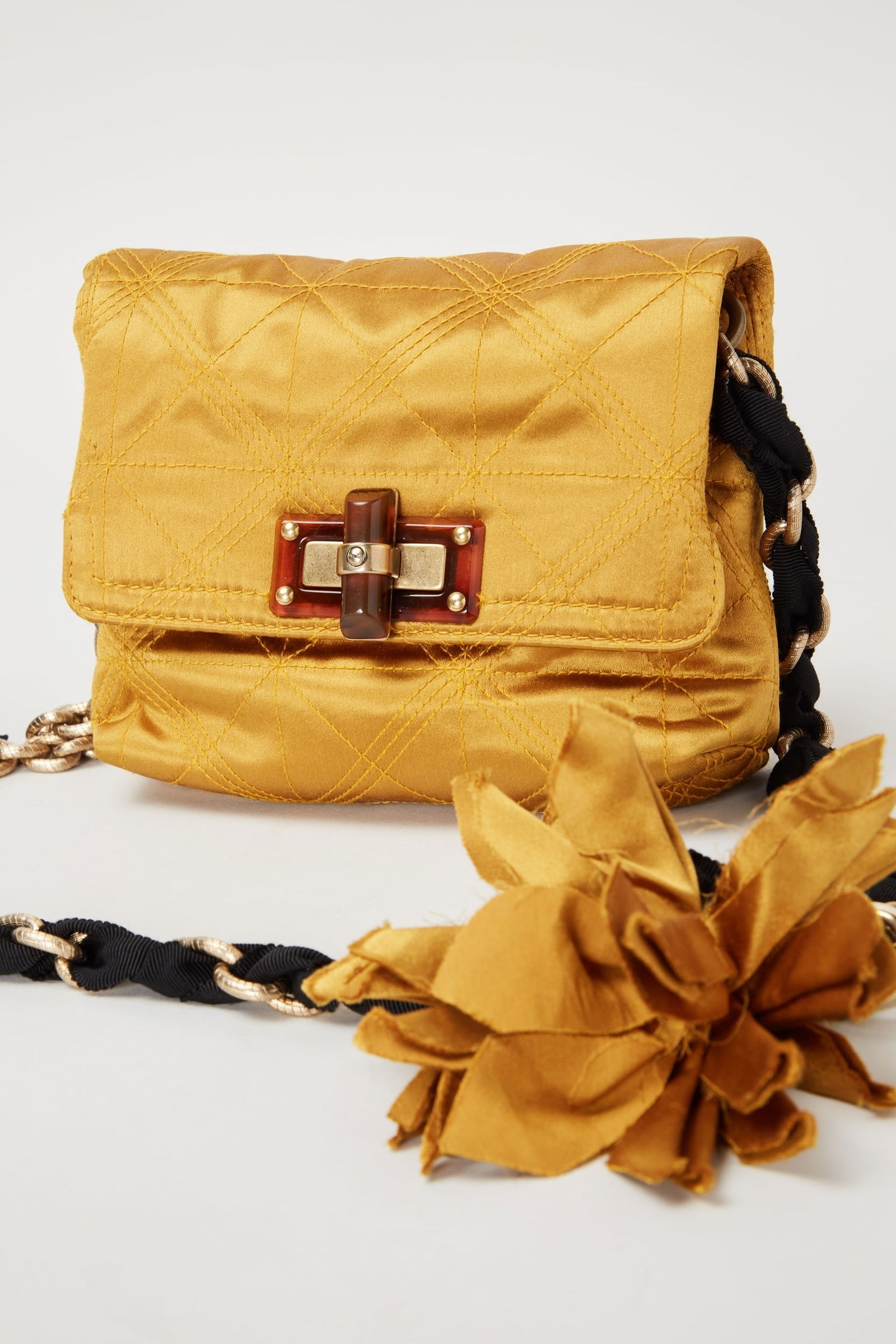 Lanvin Paris | Alber Elbaz Era Happy Mini Pop Crossbody Bag: Lanvin Paris stain Happy Mini Pop crossbody bag during Alber Elbaz Era.The yellow mini flap features a chain-link handle woven with grosgrain ribbon and with a floral corsage detail. It opens with a