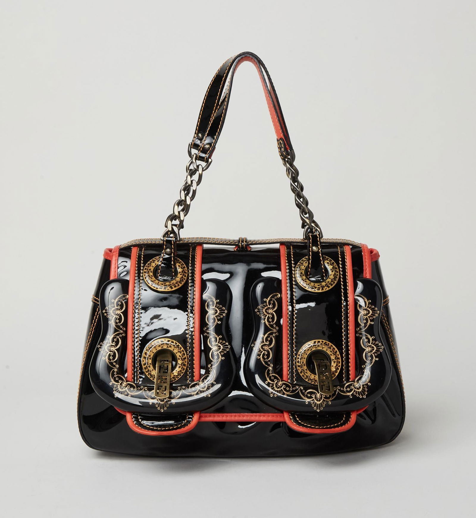 Fendi | Fall 2006 B bag: Fendi Patent leather B Bag from the Fall 2006 Ready to Wear collection Modeled by Inguna Butane (Look 21).The black patent leather top handle bag with orange leather trim embellishment. Printed on the