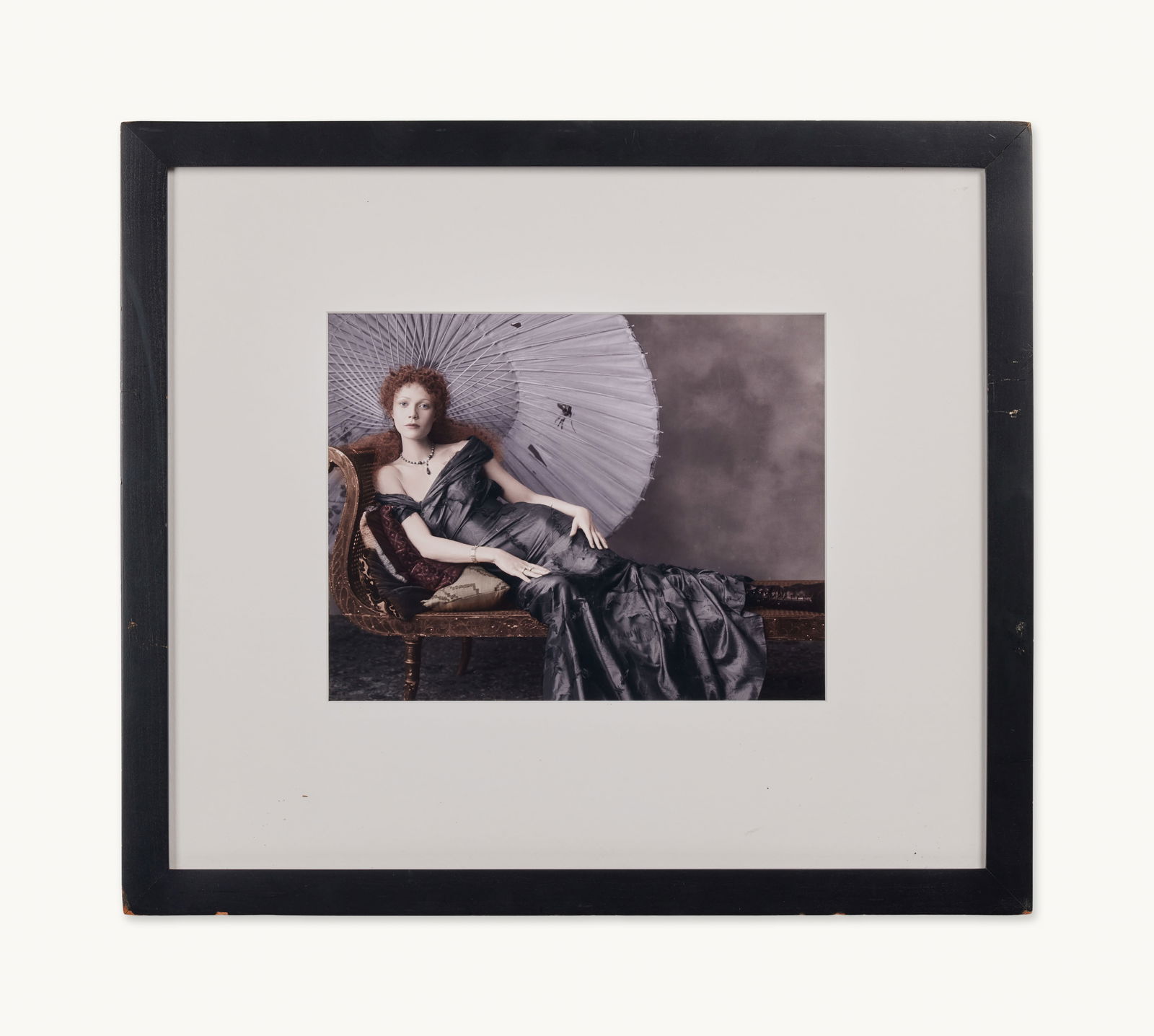 Gwyneth Paltrow | 1999 Steven Meisel Vogue September Issue Print: A custom framed Steven Meisel print of Gwyneth Paltrow's September 1999 Vogue Shoot, titled "Period Drama," from The Collection of Gwyneth Paltrow. The image features Paltrow reclining on a chais