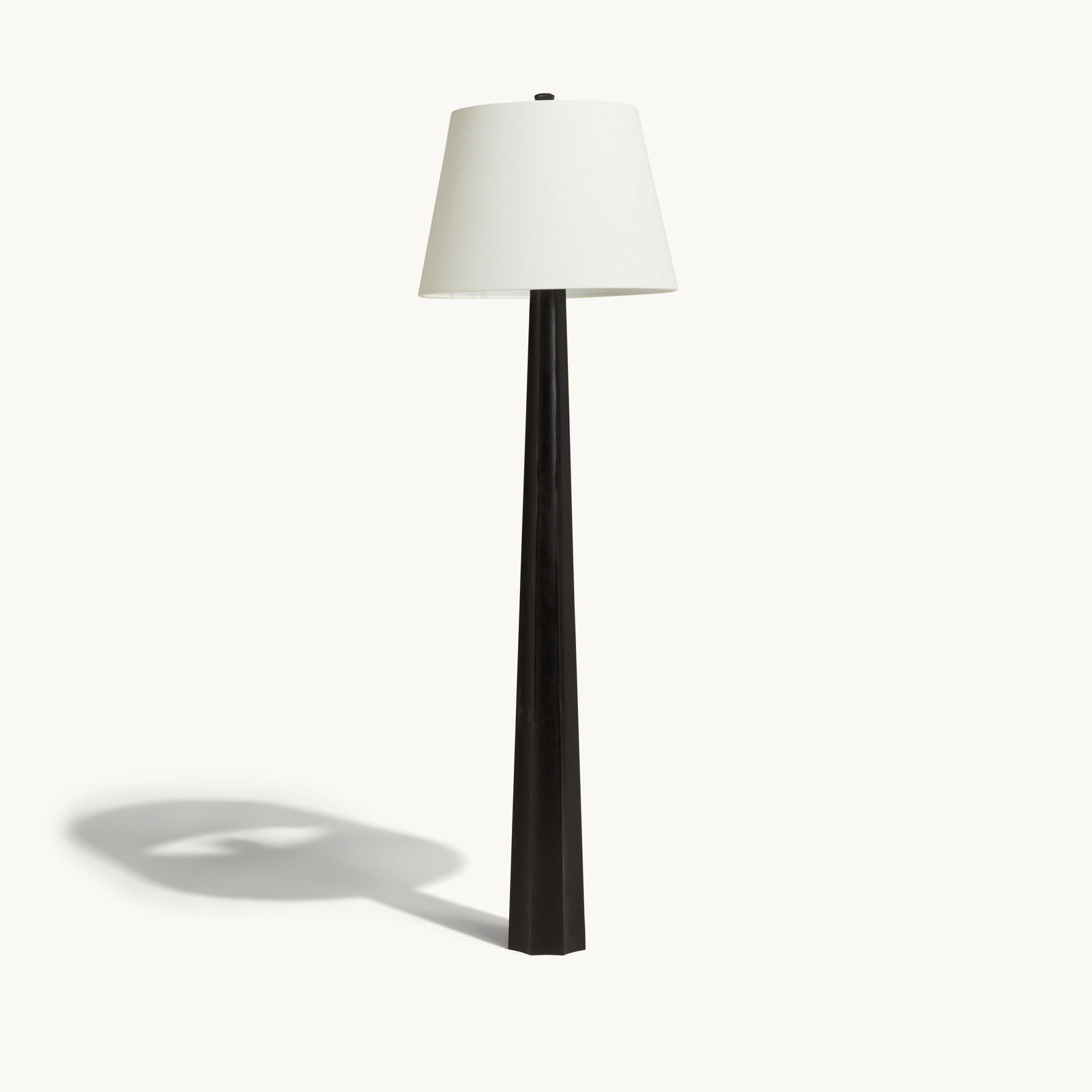 Gwyneth Paltrow | Chapman & Myers Fluted Spire Floor Lamp: A contemporary floor lamp with a black tapering fluted base and a white linen shade.This article is from Gwyneth Paltrow’s former Brentwood home in Los Angeles, where she collaborated with inter