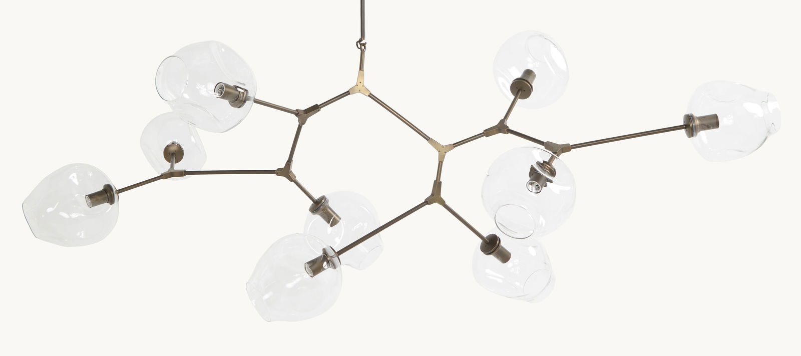 Gwyneth Paltrow | Lindsey Adelman Nine Globe Branching Bubble Chandelier: A nine-light pendant light fixture with patinated bronze body and colorless hand-blown glass globes.Lindsey Adelman turns light into art, combining hand blown glass and industrial elements to create s
