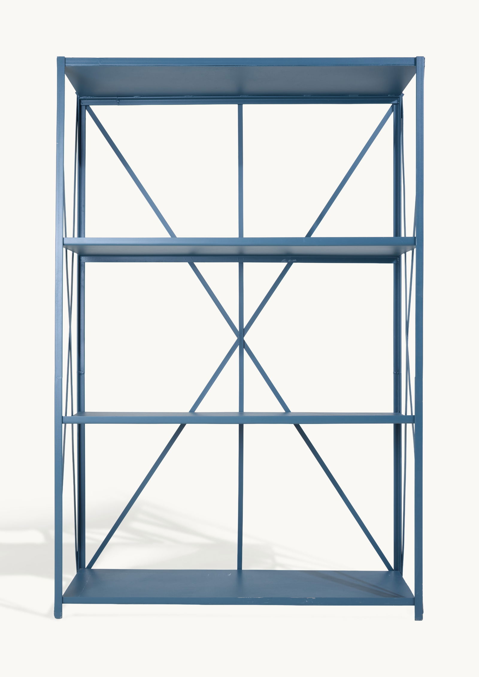 Gwyneth Paltrow | Industrial Bookshelf: A blue painted metal Industrial style bookshelf, open on all sides. This article is from Gwyneth Paltrow’s former Brentwood home in Los Angeles, where she collaborated with interior designe