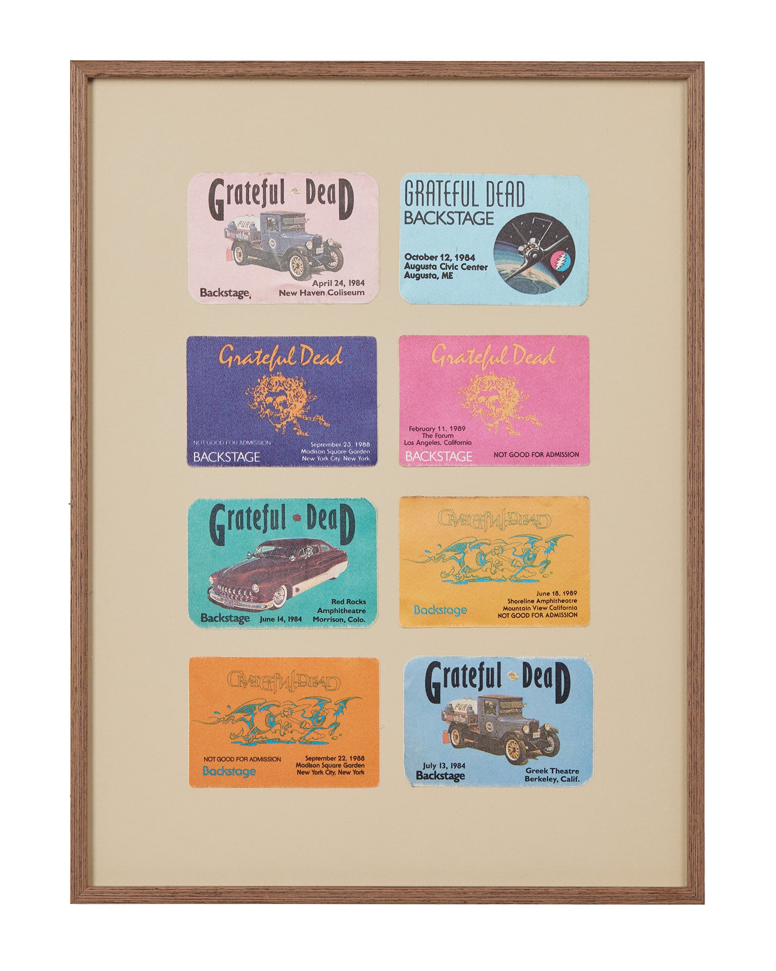 Grateful Dead | Framed Late 1980s Backstage Passes: Eight pictorial Grateful Dead backstage passes for concerts c. 1980s. Framed and matted. The passes are for the following shows: April 24 1984 at New Haven Coliseum in New Haven CT. October 12
