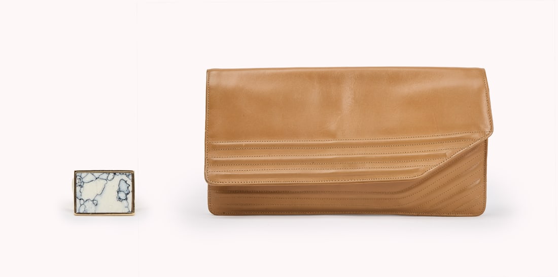 And Just Like That... | Miranda Hobbes Season 3 Episode 6 Clutch and Jewelry: A collection of accessories worn by Miranda Hobbes in Season 3, Episode 6 of And Just Like That? (HBO Max, 2021-2025). The purse, a vintage Jane Shilton for Harrods piece, is a leather envelope-style