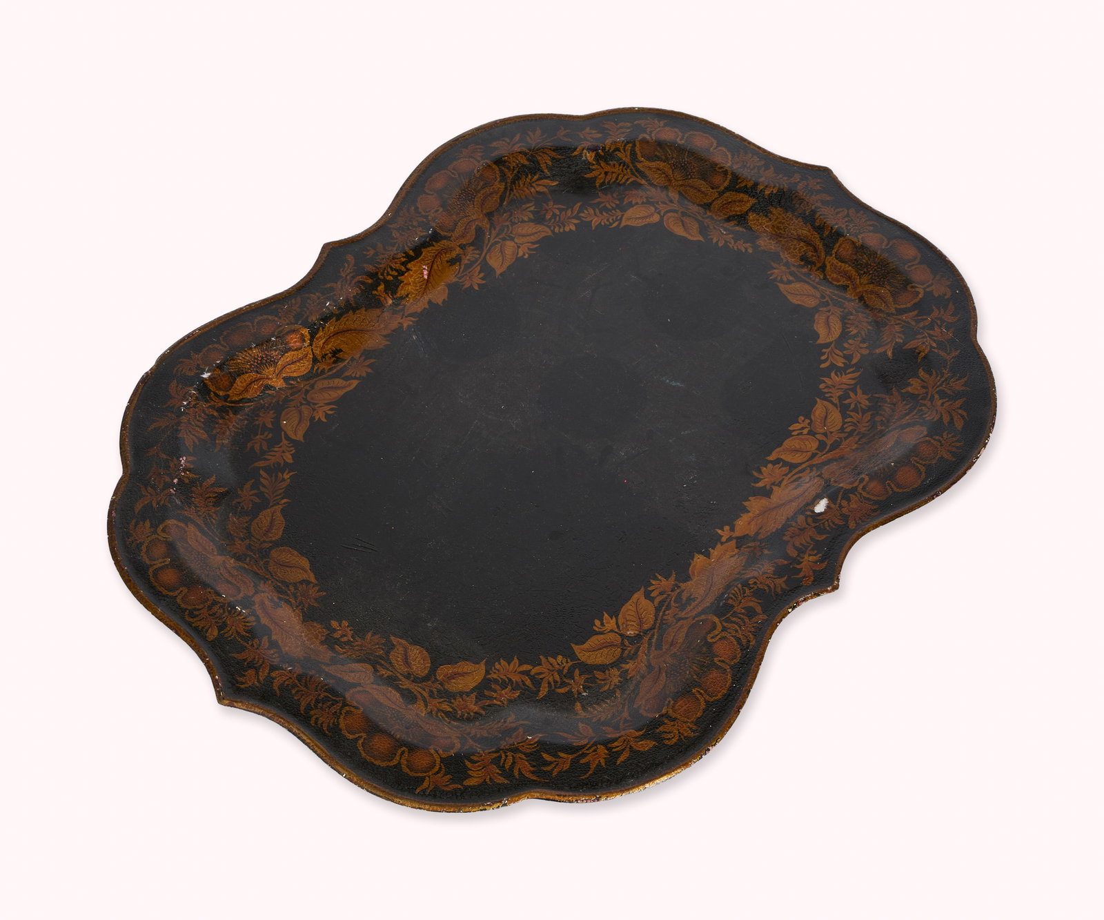 And Just Like That... | Carrie Bradshaw's Vintage Hand-Painted Toleware Tray: A vintage shaped hand painted tole tray decorated with orange leaves and flowers on a black ground. A one-time donation will be made by Warner Bros. Discovery to You Gotta Believe (YGB) at the conclus