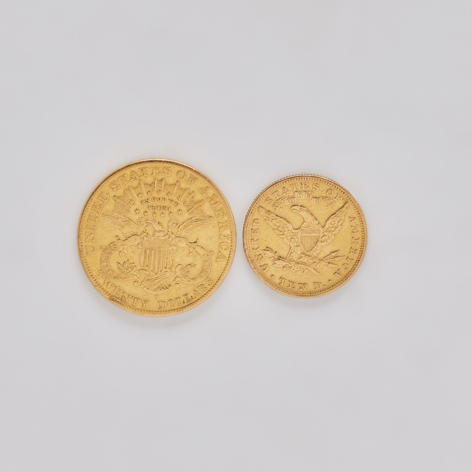 Jerry Weintraub | Two Gold Coins: Comprising a 1901 Liberty $20 Double Eagle coin; and a 1893 Liberty $10 Eagle coin.