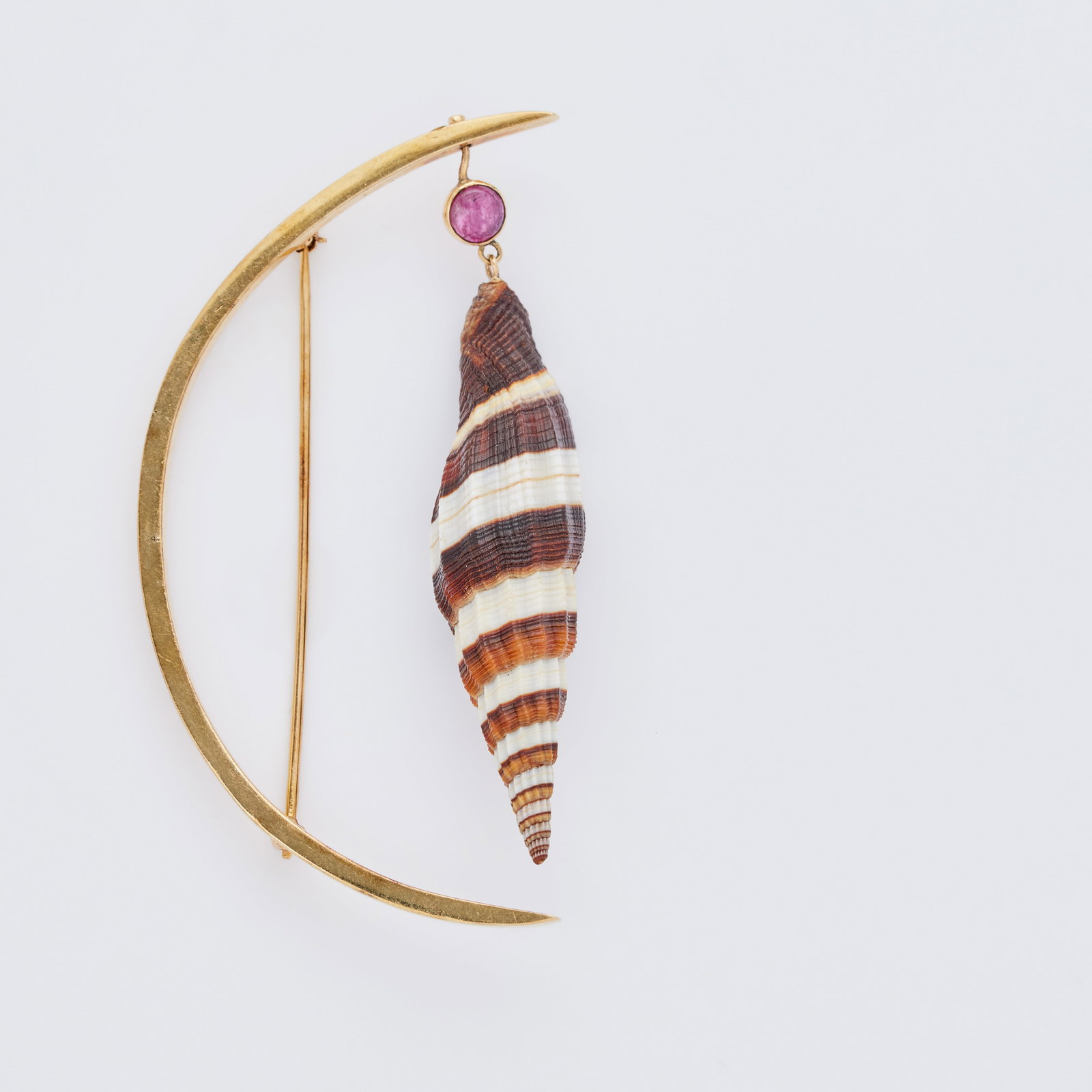 Jerry Weintraub | 14K Yellow Gold and Seashell Modernist Brooch: Designed as a polished 14k yellow gold crescent, suspending an articulated natural seashell, 3 inches long, 16.2 grams.Marked 14k.