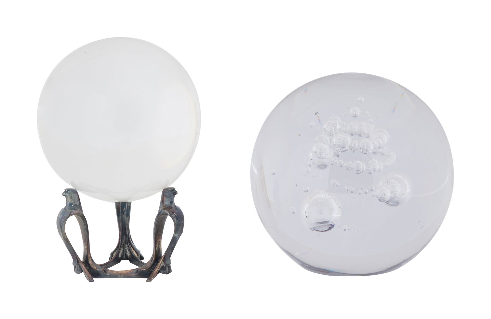 Jerry Weintraub | Two Glass Spheres and a Stand: A crystal ball on tripod eagle metal stand, together with a glass paperweight sphere with internal bubbles marked "Clichy/ France." From the Estates of Jerry Weintraub and Jane Morgan
