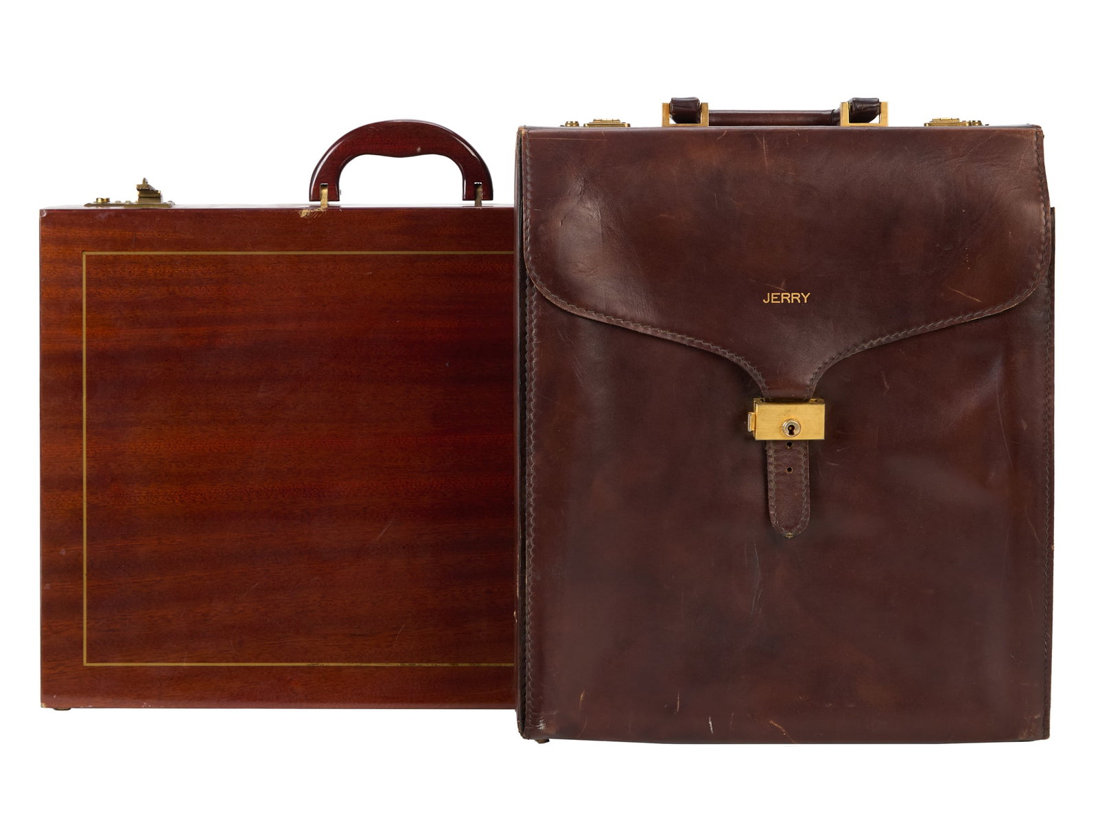 Jerry Weintraub | Two Briefcases: A group of two briefcases owned and used by Jerry Weintraub.The first is a personalized Italian leather small gentlemen's brief case with "Jerry" embossed on front flap closure.The second is a