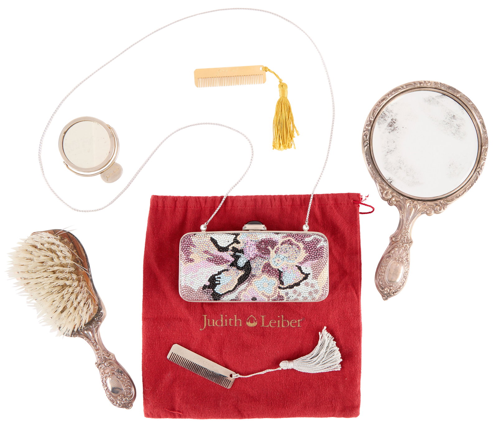 Jerry Weintraub | Crystal Evening Bag, Mirrors, and Brush: A group of accessories, including a Judith Lieber crystal evening bag with a dust cover, comb set, and optional shoulder strap; a silver-tone hand mirror; a Judith Lieber silver-tone hand mirror; a