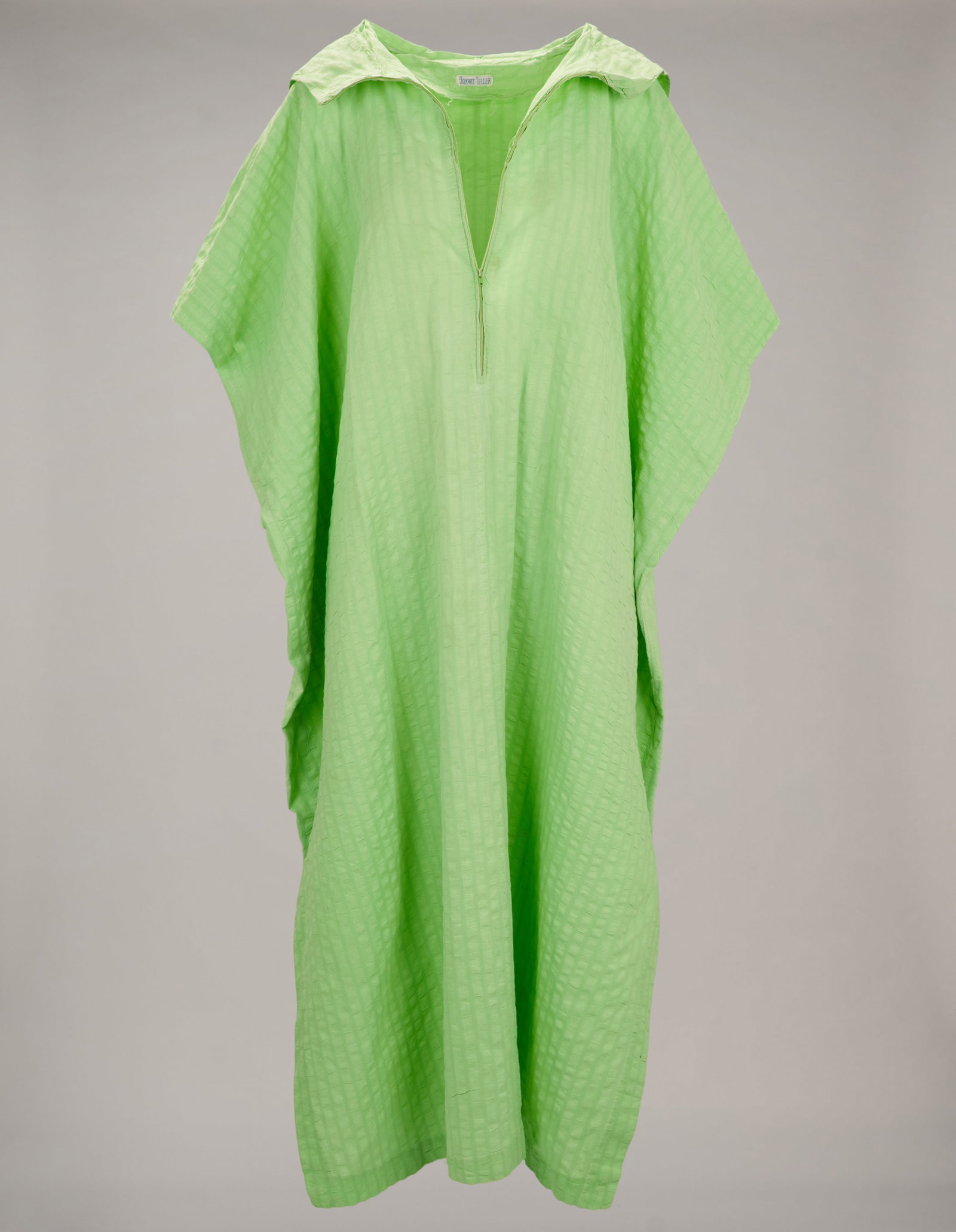 Roberta Flack | Vintage Stephen Burrows Dress and Additional Bonwit Teller Caftan: A vintage blue cotton maxi-dress with white cap sleeves and red contrast stitching on the trim, with "Stephen Burrows' World" and "Bonwit Teller" labels present; and a lime green zip-up hooded caftan 