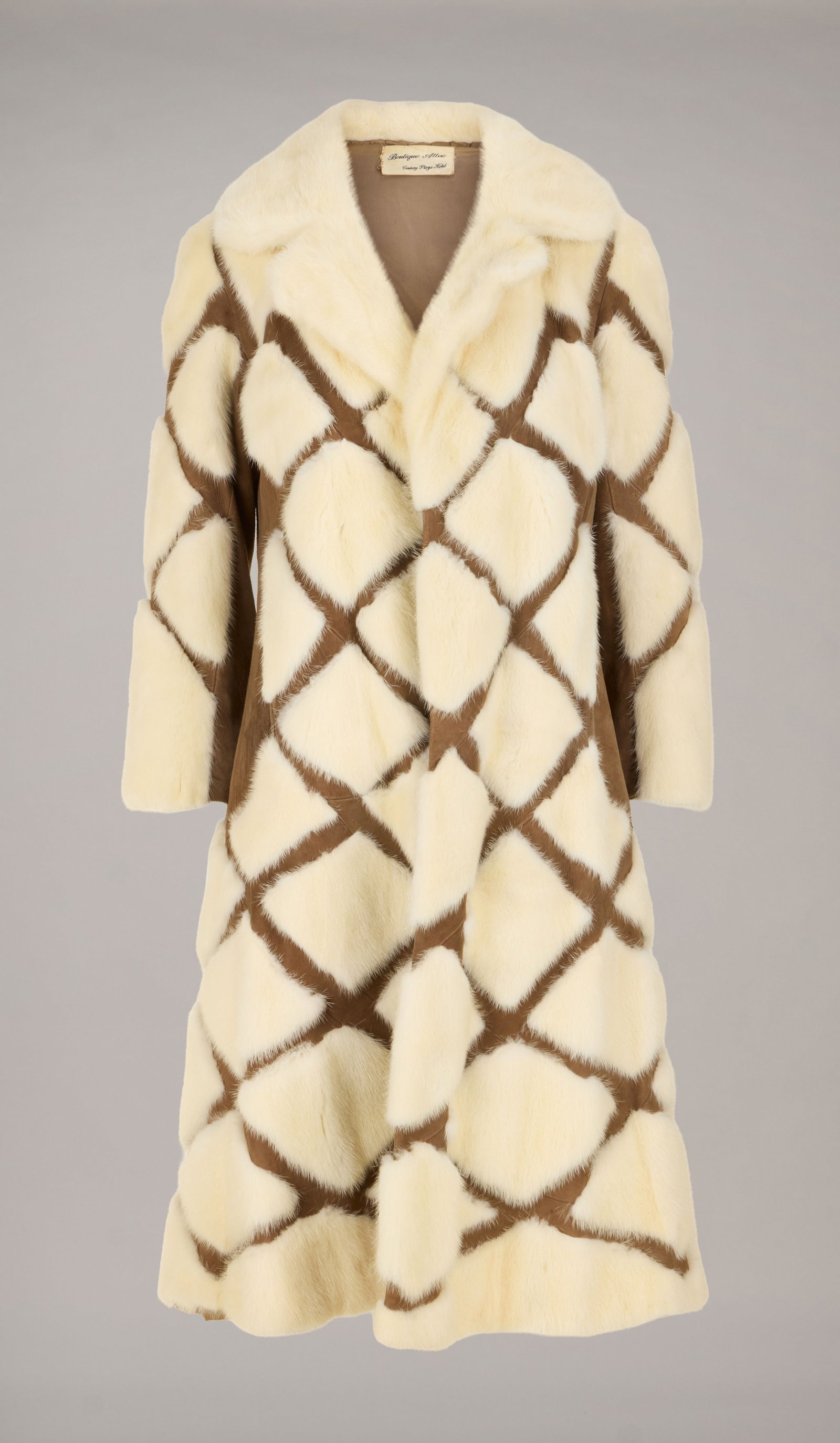 Roberta Flack | Vintage Fur Coats: Two vintage coats including a teal velvet coat with chinchilla fur trim and gold bullion embroidered thread labeled "Lune En Papier Inc.;" and a brown leather coat with white mink fur patche