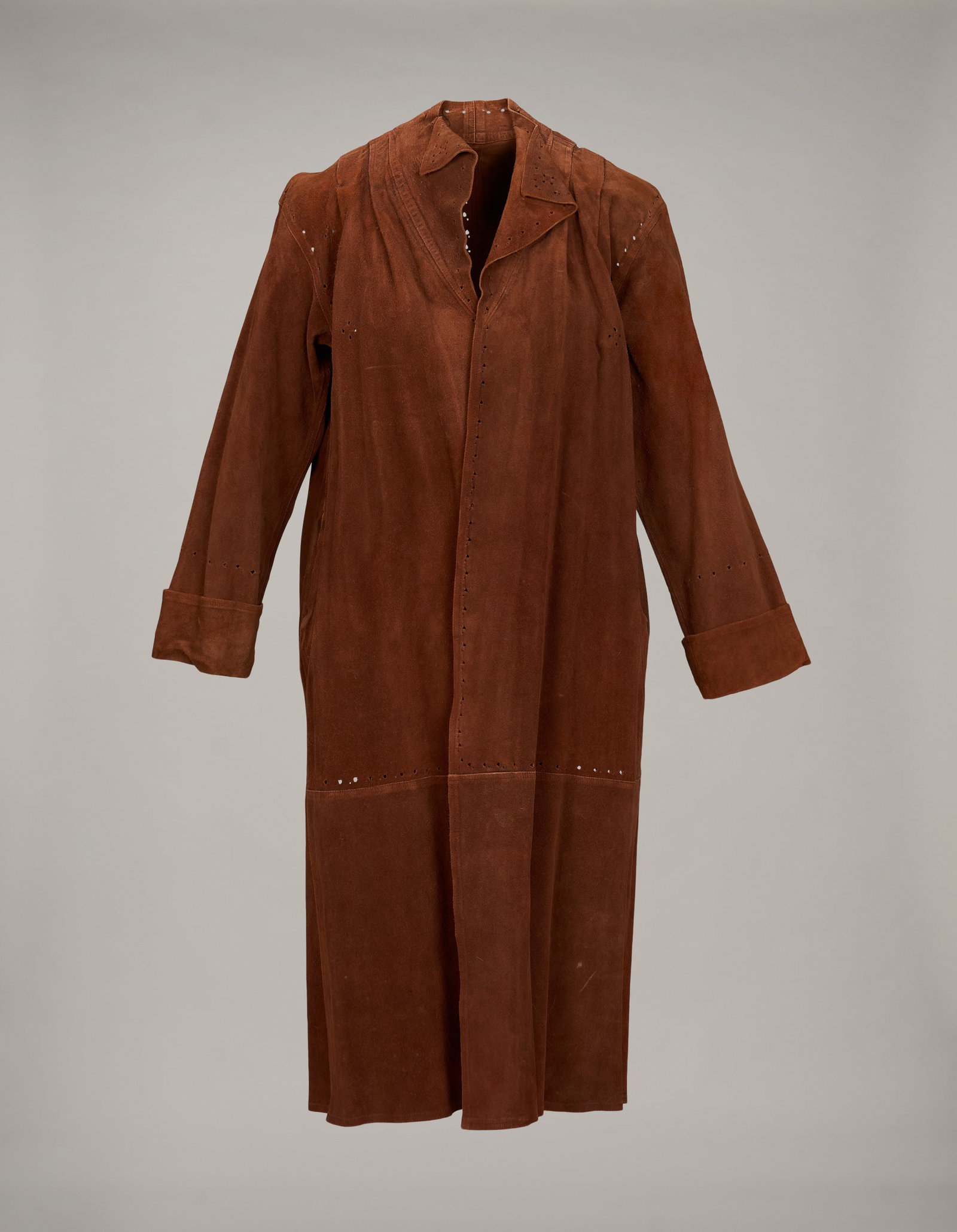 Roberta Flack | Jean Muir and Additional Cut Leather Coat: Two cut leather jackets including: a Jean Muir light brown suede long coat designer label present (not attached) size 8; and an aubergine purple leather coat no size or label present. Fro