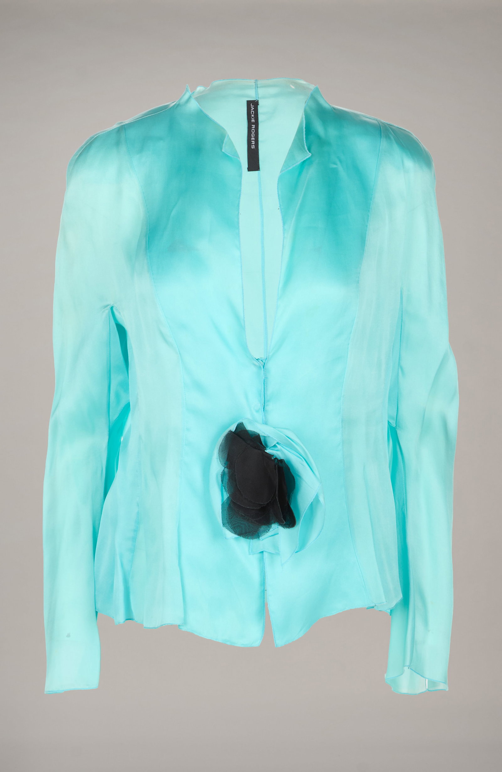 Roberta Flack | 2005 Event-Worn Jackie Rogers Jacket and Additional Ensemble with Photo: A silk turquoise Jackie Rogers ruffled top worn by Roberta Flack to the Dress For Success "April In Paris" annual gala at Marriott Marquis on April 19, 2005, in New York City, NY. Together 