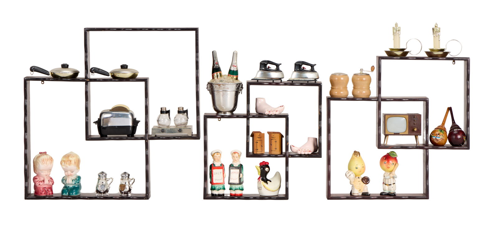 Hank Williams Sr. | Novelty Salt & Pepper Shaker Sets with Shelving: A collection of novelty salt and pepper shakers, including: a pair of candlesticks; pear and apple baseball players; a pair of irons; a toaster with each piece of plastic toast (2) holding salt or pep
