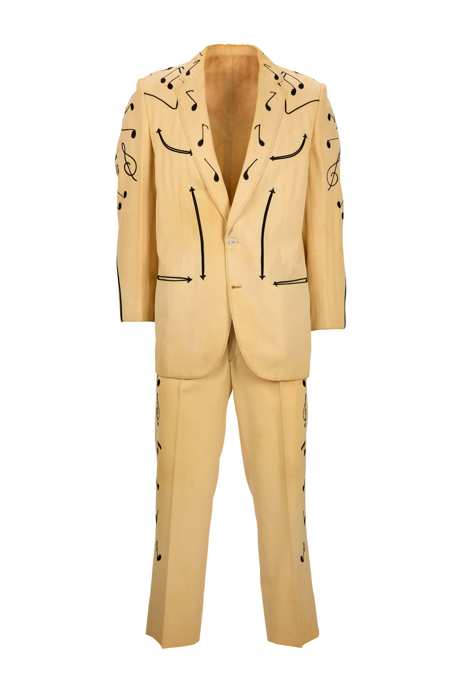 Tex Montana | 1960s Photo-Worn Music Note Nudie Suit: A Nudie's Rodeo Tailors embroidered western suit, custom-made for country artist Tex Montana, c. 1960s. The cream two-piece suit features a black embroidered music note design on the jacket and 