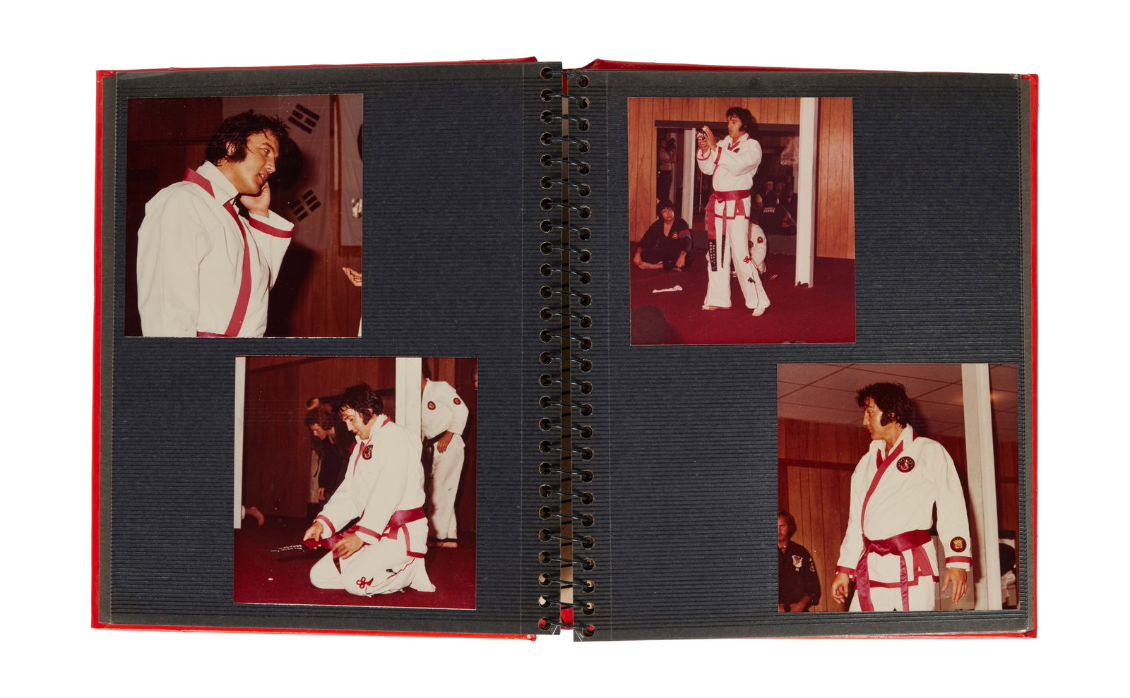 Elvis Presley | Photo Album of Unpublished Karate Photos: A large photo album containing approximately 35 professional and unpublished photographs of Elvis Presley participating in karate. The photos are housed in a red leather photo album. 
