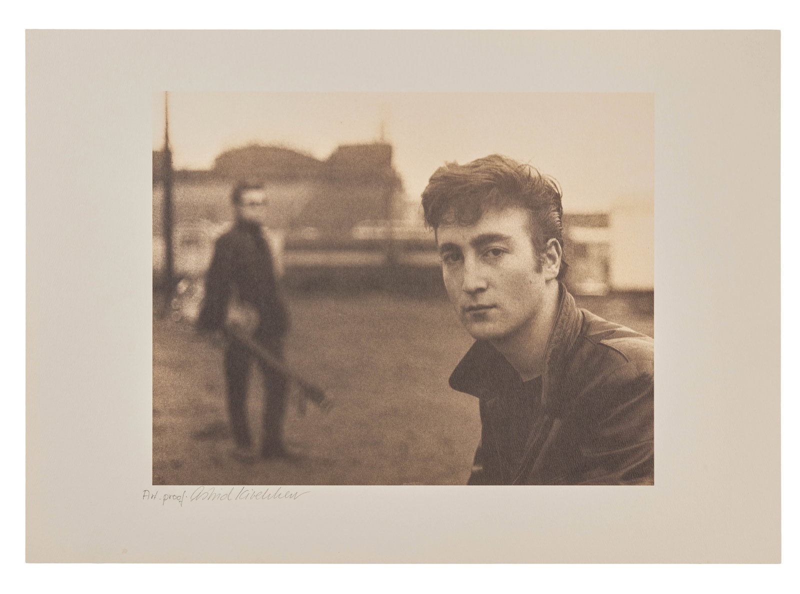 The Beatles | Astrid Kirchherr Signed John Lennon Artist Proof Lithograph: A lithograph bearing an image of John Lennon taken by the photographer Astrid Kirchherr in November 1960 at Heiligengeistfeld Square in Hamburg, Germany as part of the Beatles' first photo session. Th