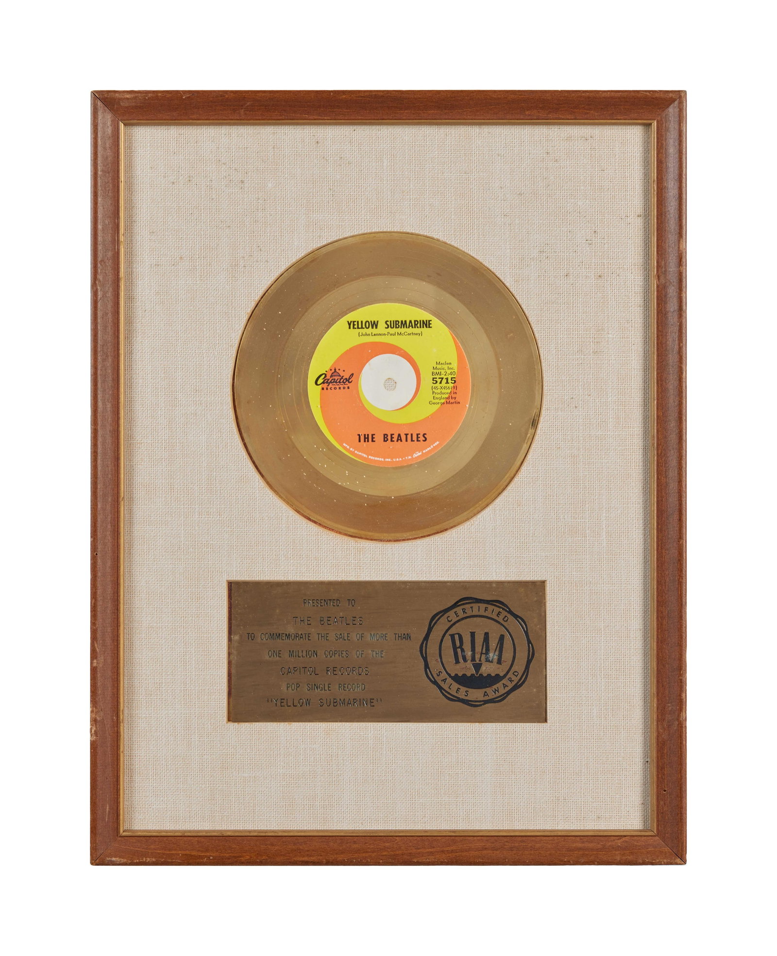 The Beatles | 1966 Yellow Submarine RIAA "Gold" Record Award: An original 1966 RIAA gold record award presented to The Beatles to commemorate the sale of more than one million copies of the Capitol Records single "Yellow Submarine." Housed in the original 