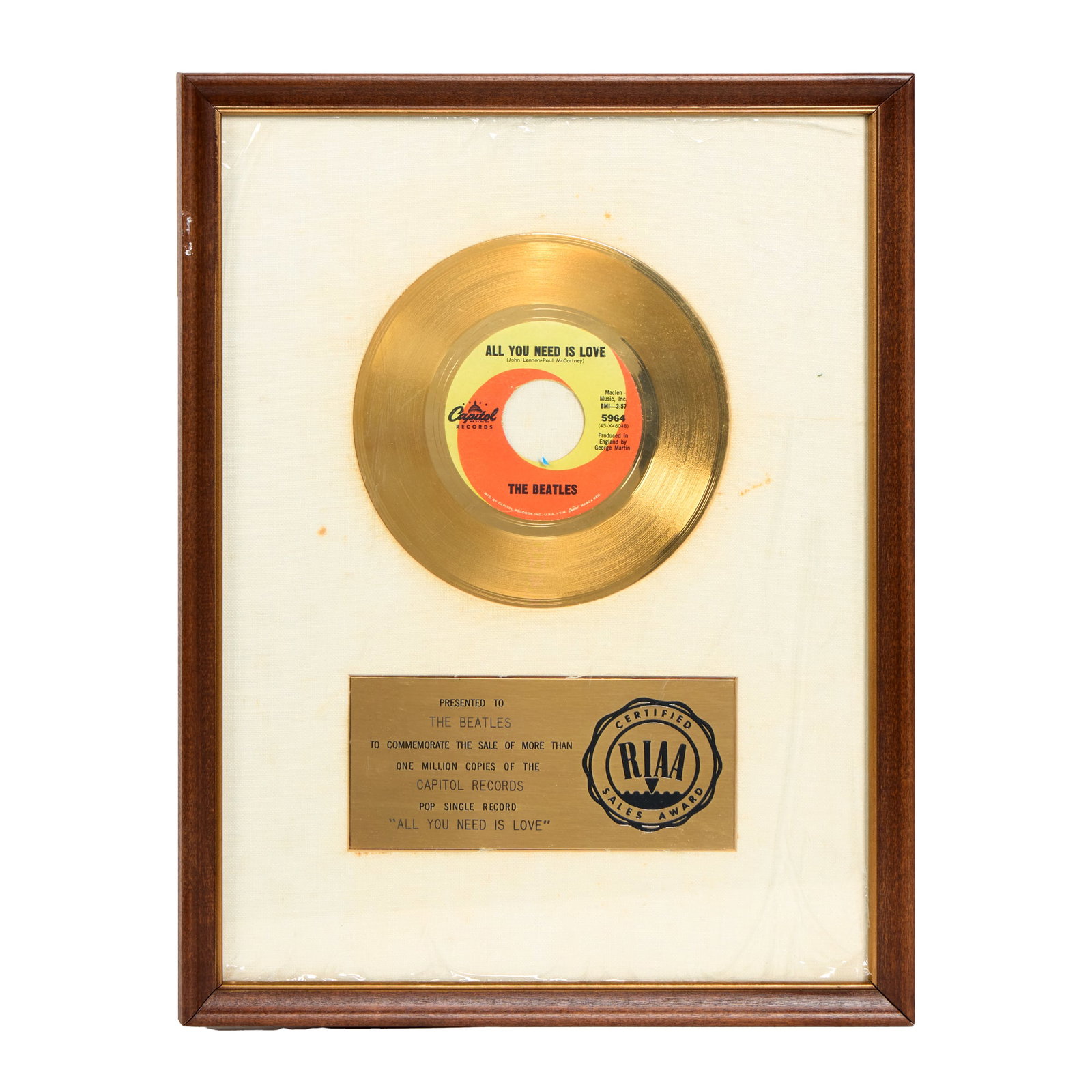 The Beatles | White Matte Record Award "All you Need is Love": An RIAA-certified "gold" record award, white linen matte, presented to The Beatles to commemorate the sale of more than one million copies of the Capitol Records pop single record "All You Need Is Lov