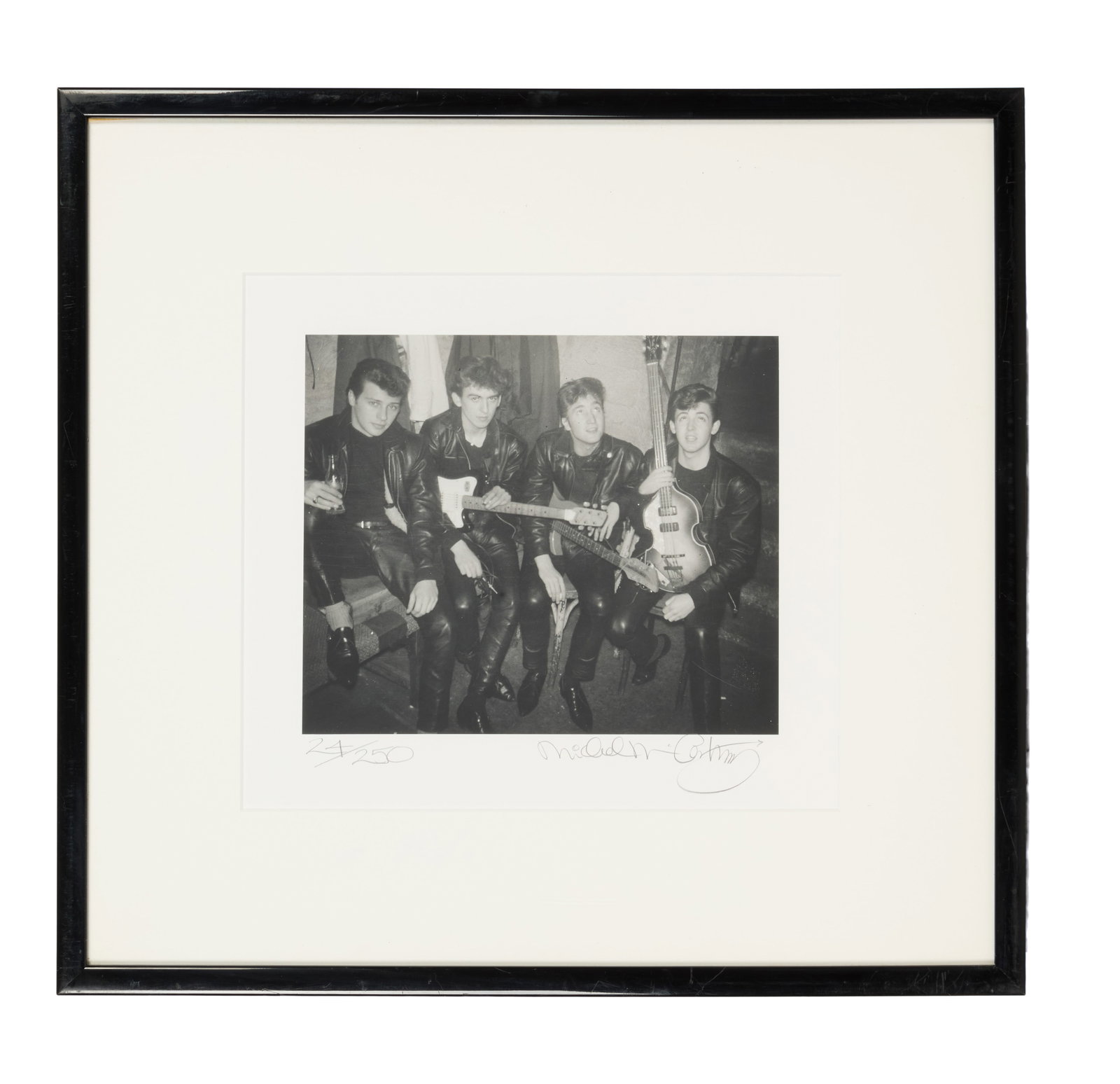 The Beatles | Signed Michael McCartney Photo: A black and white limited edition (24/250) photo print of the Beatles (Pete Best, George Harrison, John Lennon, Paul McCartney) decked out in their leathers c. 1960-1962, taken by Paul's brother, Mich
