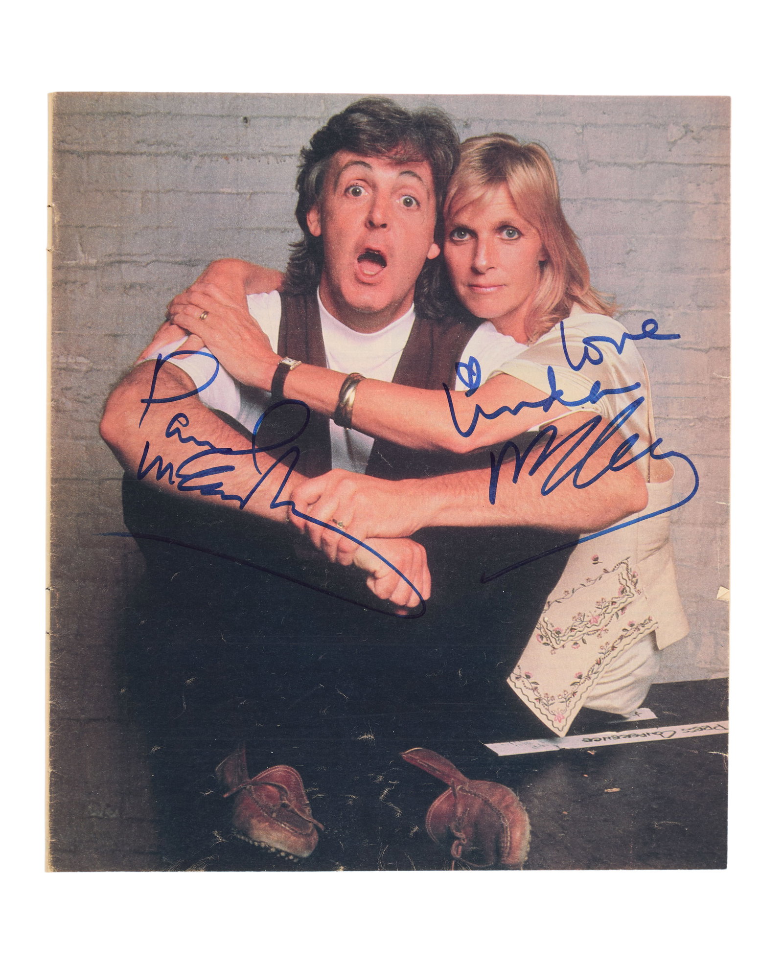 Paul and Linda McCartney | Signed Photo: A color photo of Paul and Linda McCartney, signed by them in blue marker. Accompanied by a Certificate of Authenticity from Roger Epperson Authentication Ltd. (REAL).