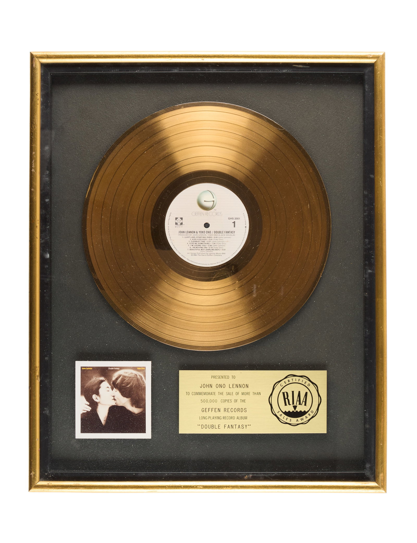 John Lennon | RIAA Gold Sales Award for "Double Fantasy": This is an RIAA award presented to John Ono Lennon to commemorate the sale of more than 500,000 copies of the John Lennon and Yoko Ono Album Double Fantasy.