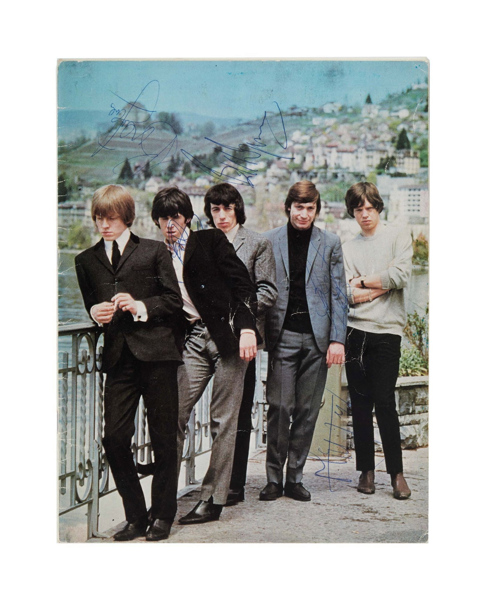 The Rolling Stones | 1966 Band Signed Concert Program: A vintage 1966 Rolling Stones concert program signed in ink by band members Mick Jagger, Keith Richards, Charlie Watts, Brian Jones, and Bill Wyman on the front cover.