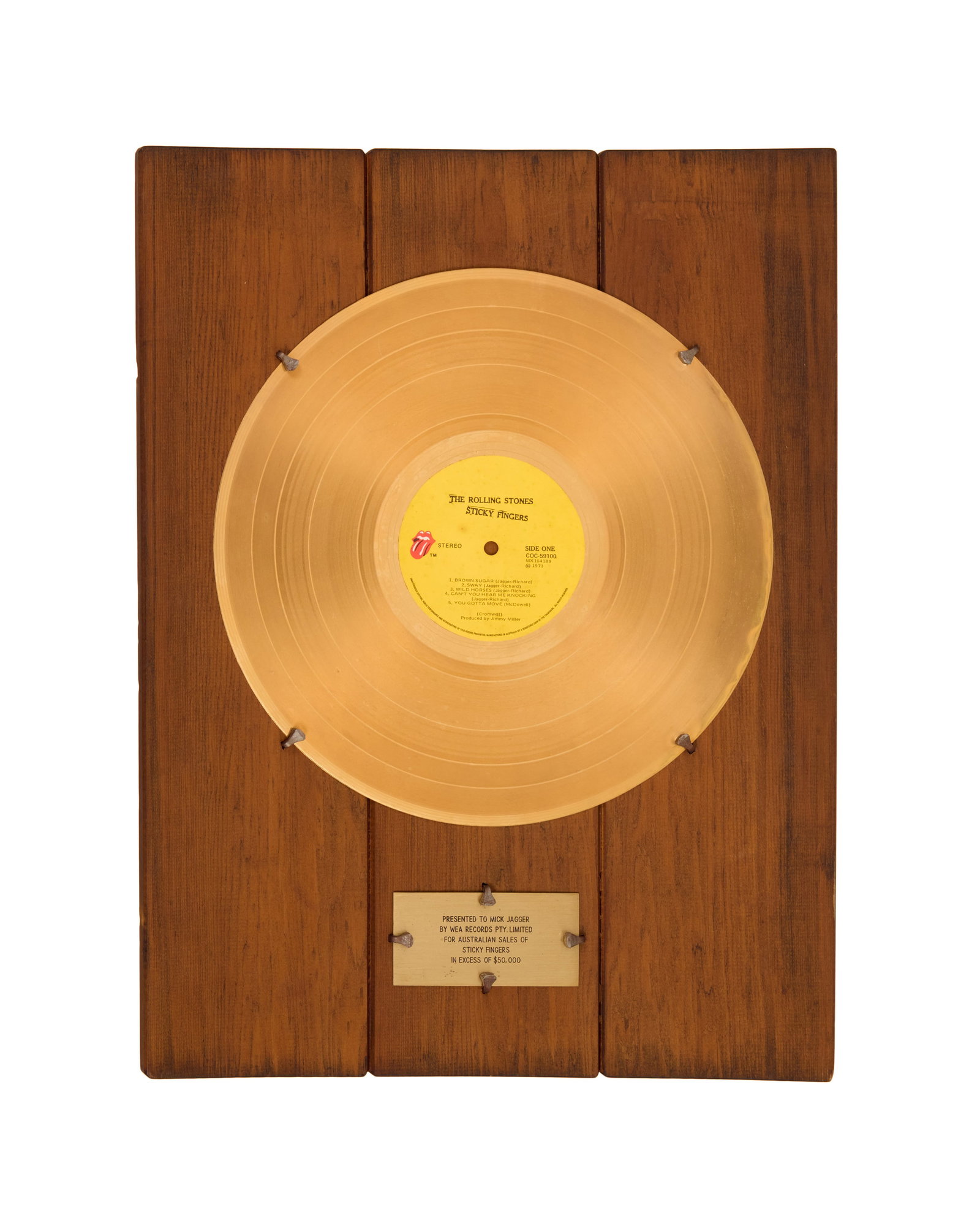 The Rolling Stones | Mick Jagger Australian In-House "Gold" Record Award: An Australian in-house "gold" record award on a paneled wood mount presented to Mick Taylor by WEA Records Pty. Limited for Australian sales of The Rolling Stones album Sticky Fingers (1971) in