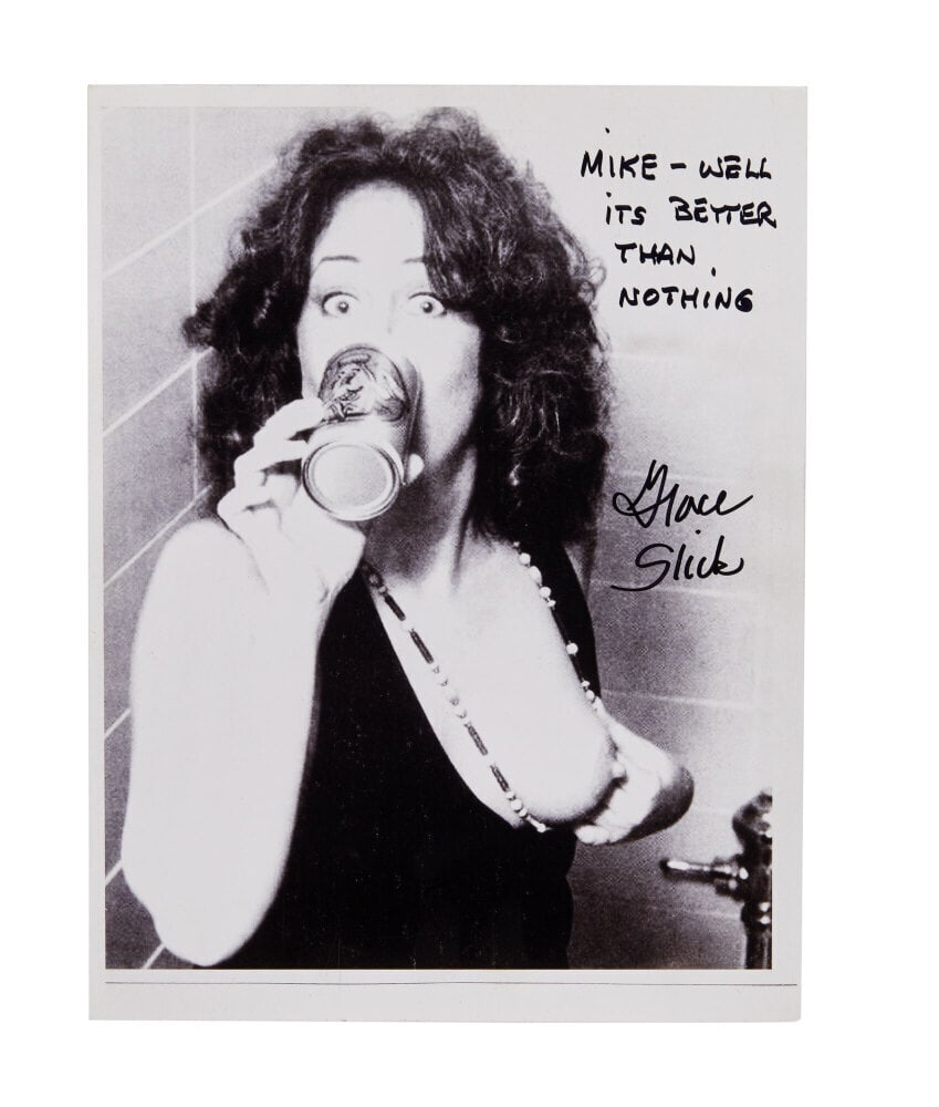 Grace Slick | Signed Photograph: A black and white photograph signed and inscribed by Grace Slick in black marker: "Mike - Well / its better / than nothing."