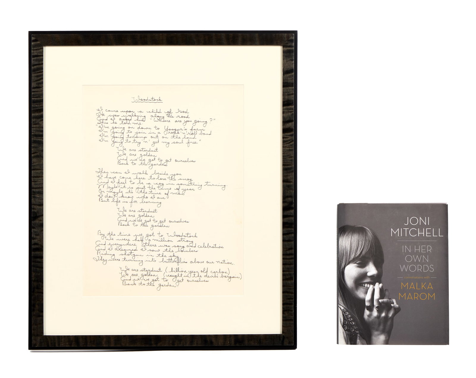 Joni Mitchell | Original Handwritten "Woodstock" Recorded Lyrics and Book: A framed original fair copy autograph manuscript of the lyrics to Joni Mitchell's 1970 song "Woodstock," as recorded, removed from a black leather artists' notepad, circa 1967-1969, the one Mitchell w