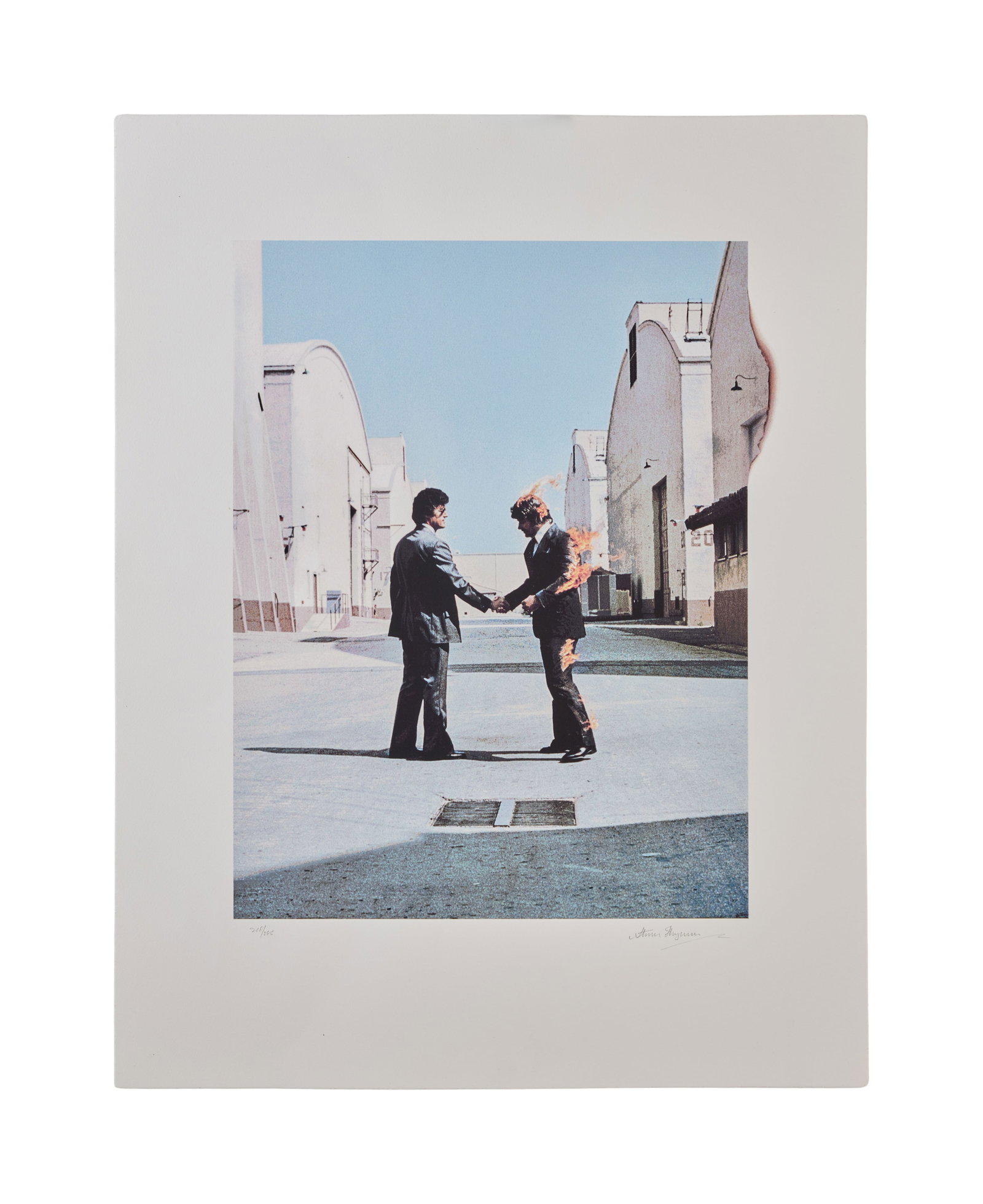 Pink Floyd | Storm Thorgerson Signed "Wish You Were Here" Print: A rare limited edition lithograph picture of the artwork for the front cover of the 1975 Pink Floyd album Wish You Were Here. The lithograph number 218/295 has been signed by the designer of the sleev