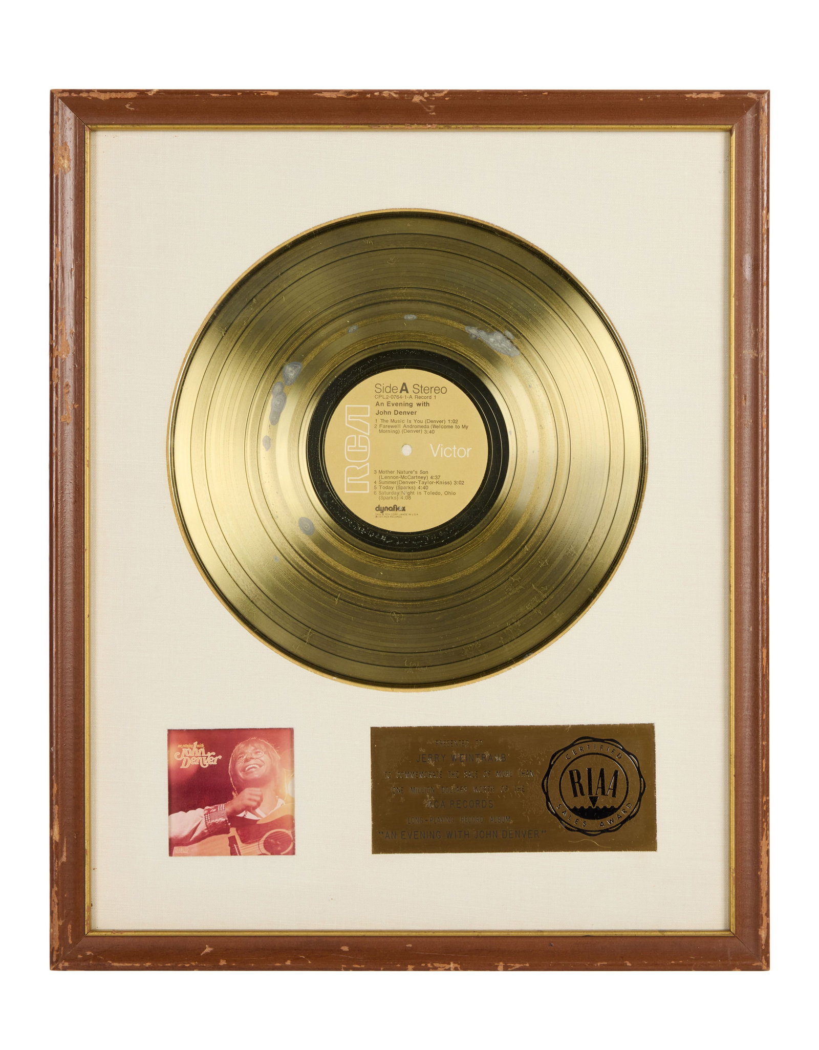 John Denver | RIAA-Certified "Gold" Sales Award for "An Evening with John Denver" Presented to Jerry: An RIAA-Certified "Gold" Sales Award presented to concert promoter and producer Jerry Weintraub to commemorate the sale of more than one million dollars worth of the long-playing John Denver reco