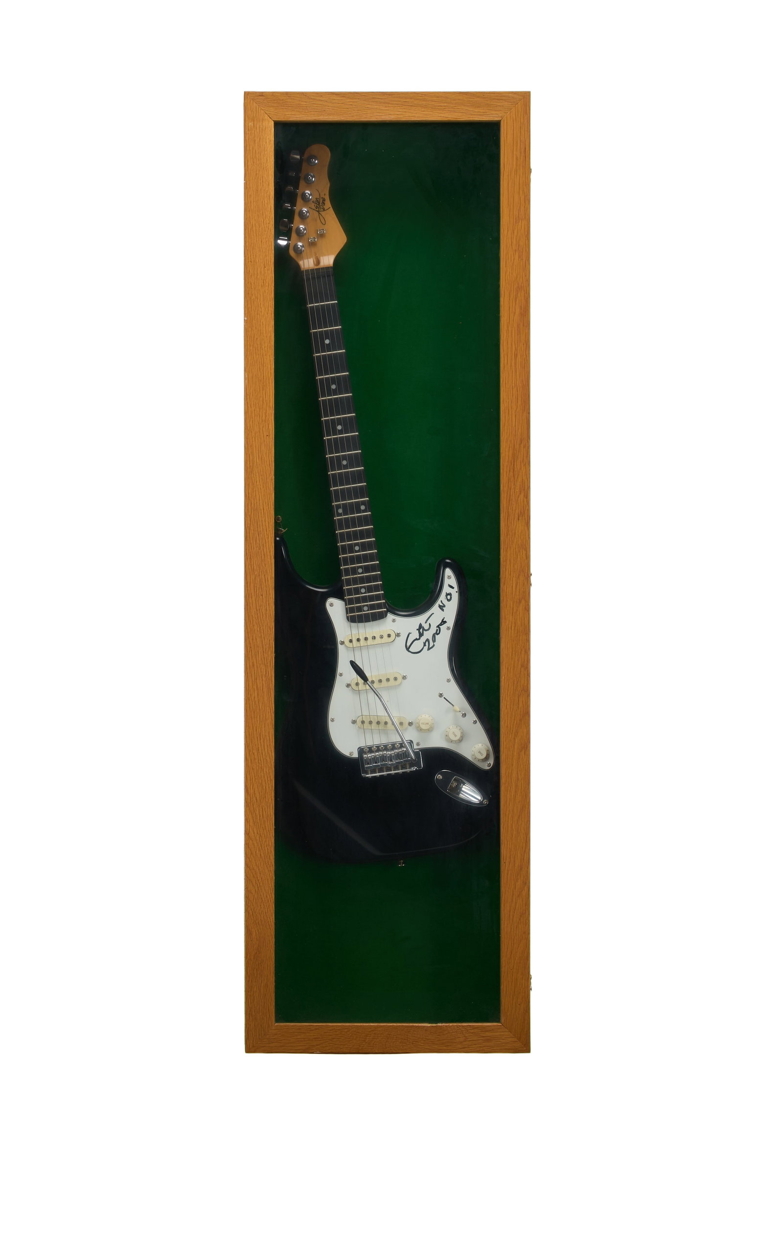 Eric Clapton | Signed Aslin Dane Strat Style Guitar in Wood Display Case: An Aslin Dane Strat-style electric guitar in black finish signed on the pickguard by Eric Clapton in black felt tip pen. Eric has inscribed "2005" and "NO!" alongside his signature. The guitar is moun