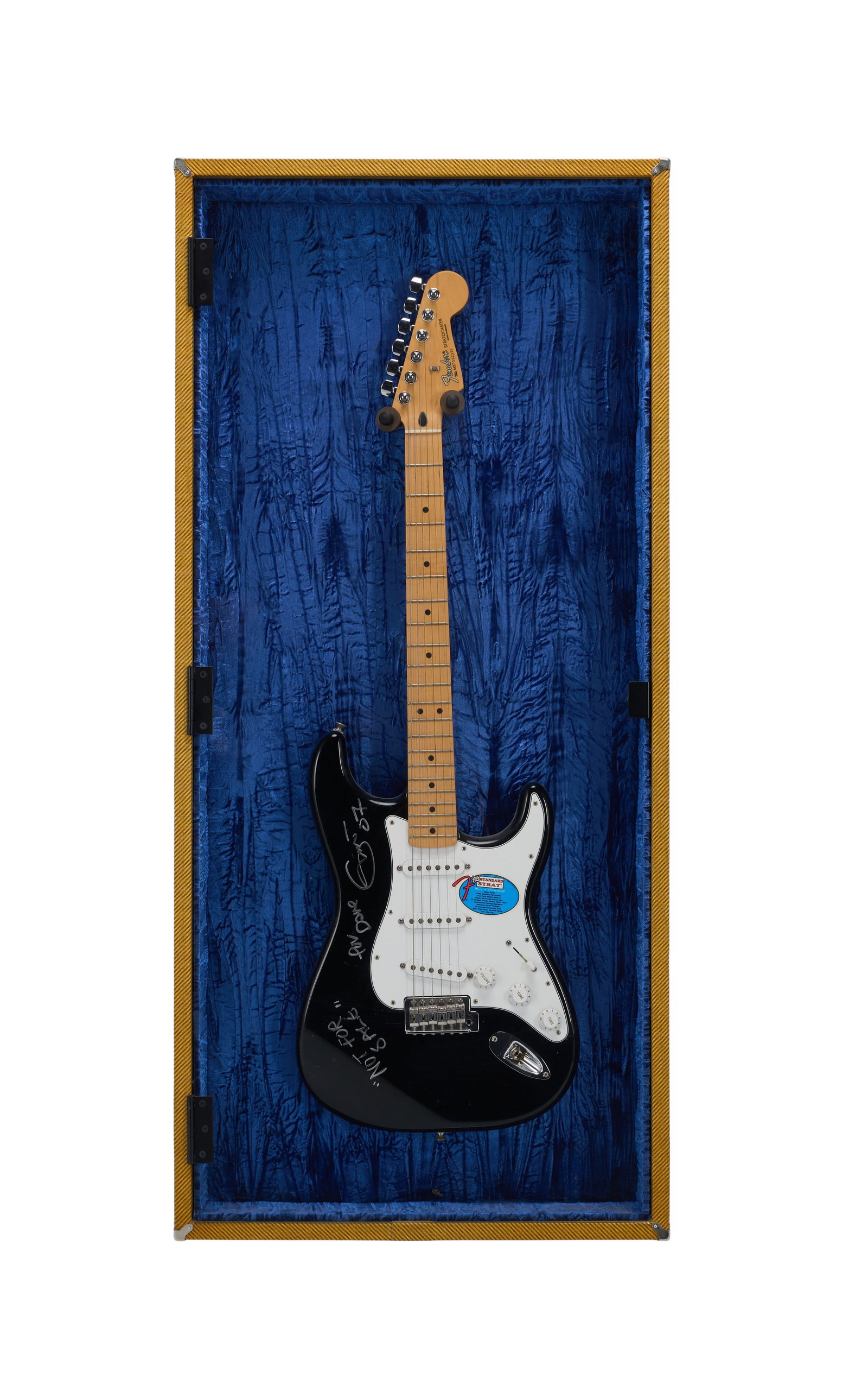 Eric Clapton | Signed Fender Mexico Standard Stratocaster in Tweed Display Case: A 2007 Fender MIM Standard Stratocaster, serial #MZ7052335, in black finish and signed in silver felt tip pen by legendary guitarist and songwriter Eric Clapton. Clapton has inscribed "Not For Sale" a