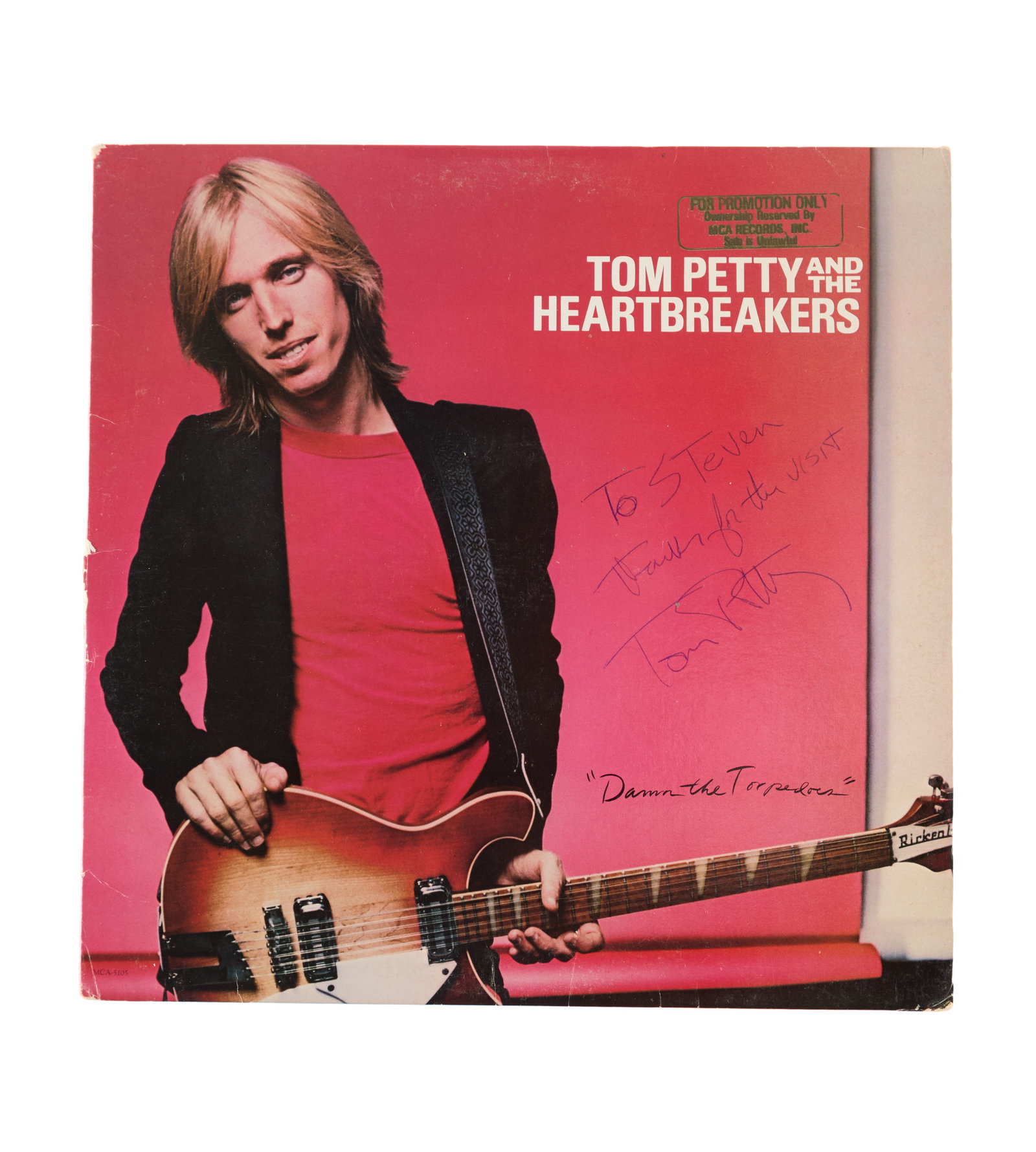 Tom Petty | Signed "Damn the Torpedoes" Promo Record Album: A gold-stamped "for promotion only" copy of Tom Petty's record album, Damn the Torpedoes, signed and inscribed in blue ink by Petty to music journalist, Steven Rosen: "To Steven / Thanks for the