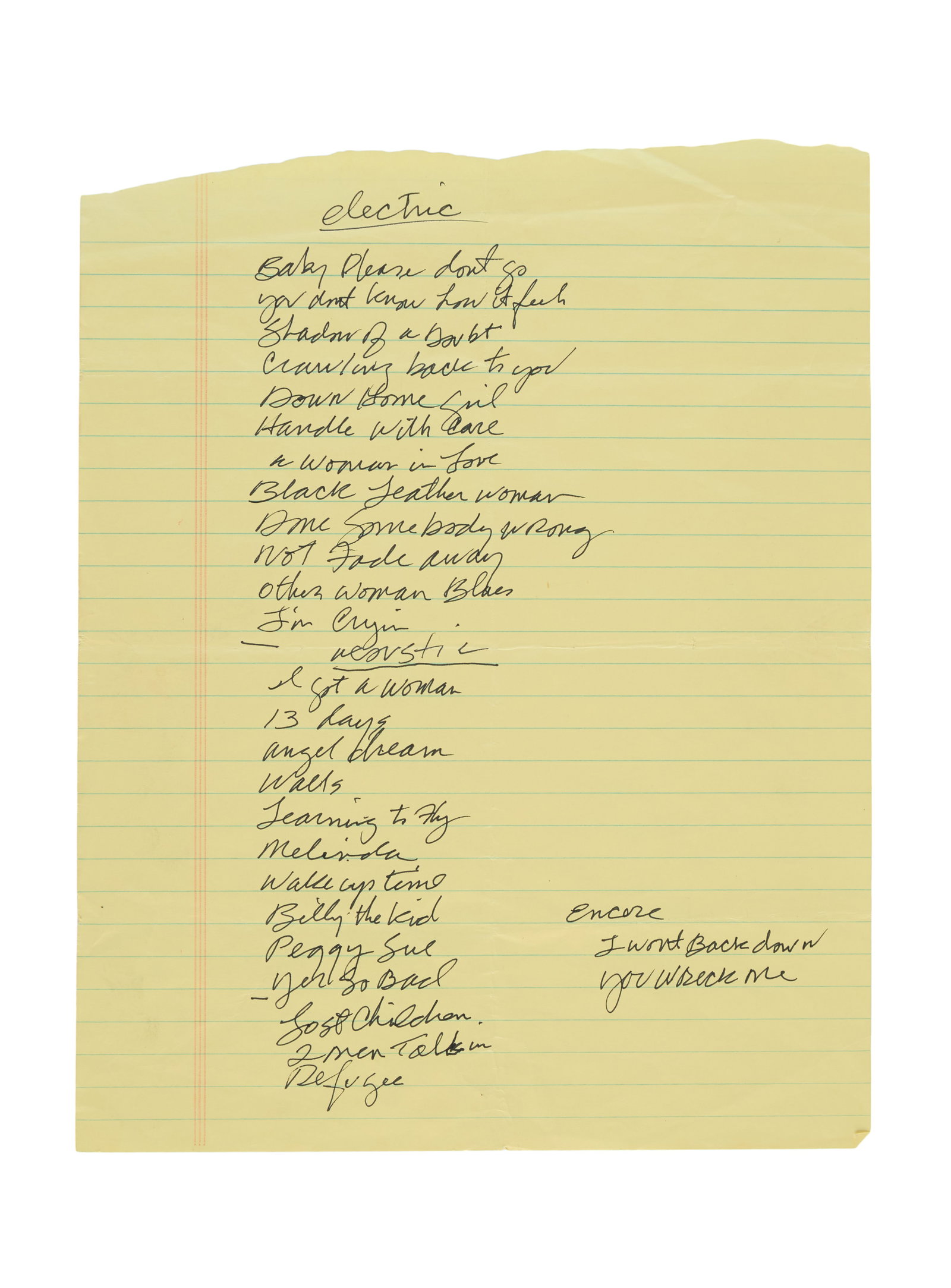 Tom Petty | 2003 Handwritten Tom Petty and the Heartbreakers Vic Theatre Setlist: A setlist, handwritten by Tom Petty in black ink on a yellow notebook page, for the Tom Petty and the Heartbreakers concert which took place on April 17, 2003, at the Vic Theatre in Chicago, IL, a par