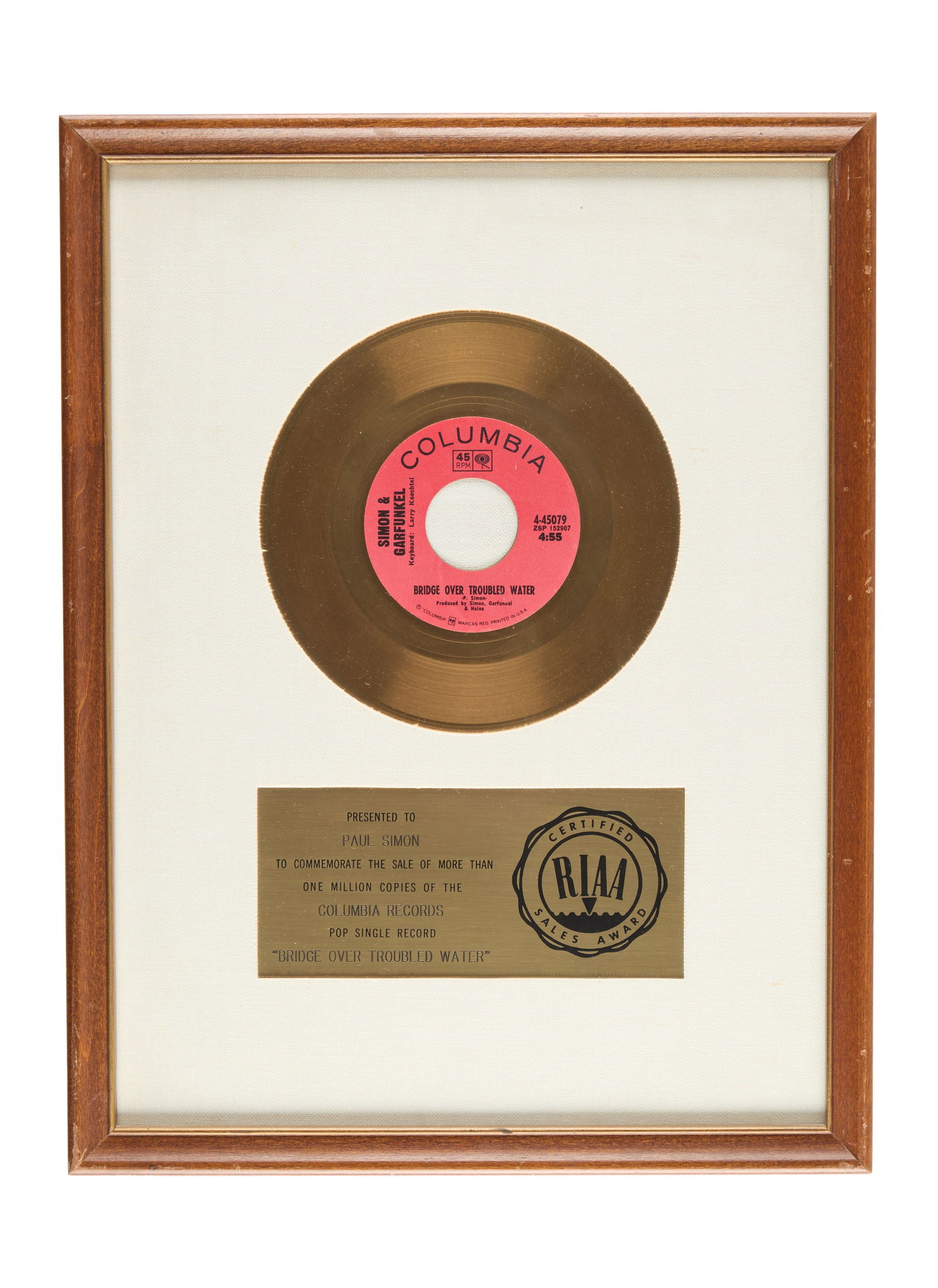 Paul Simon | RIAA Gold Single Award for "Bridge over Troubled Water": This is a RIAA Award presented to Paul Simon to commemorate the sale of more than one million copies of the single "Bridge Over Troubled Water." 