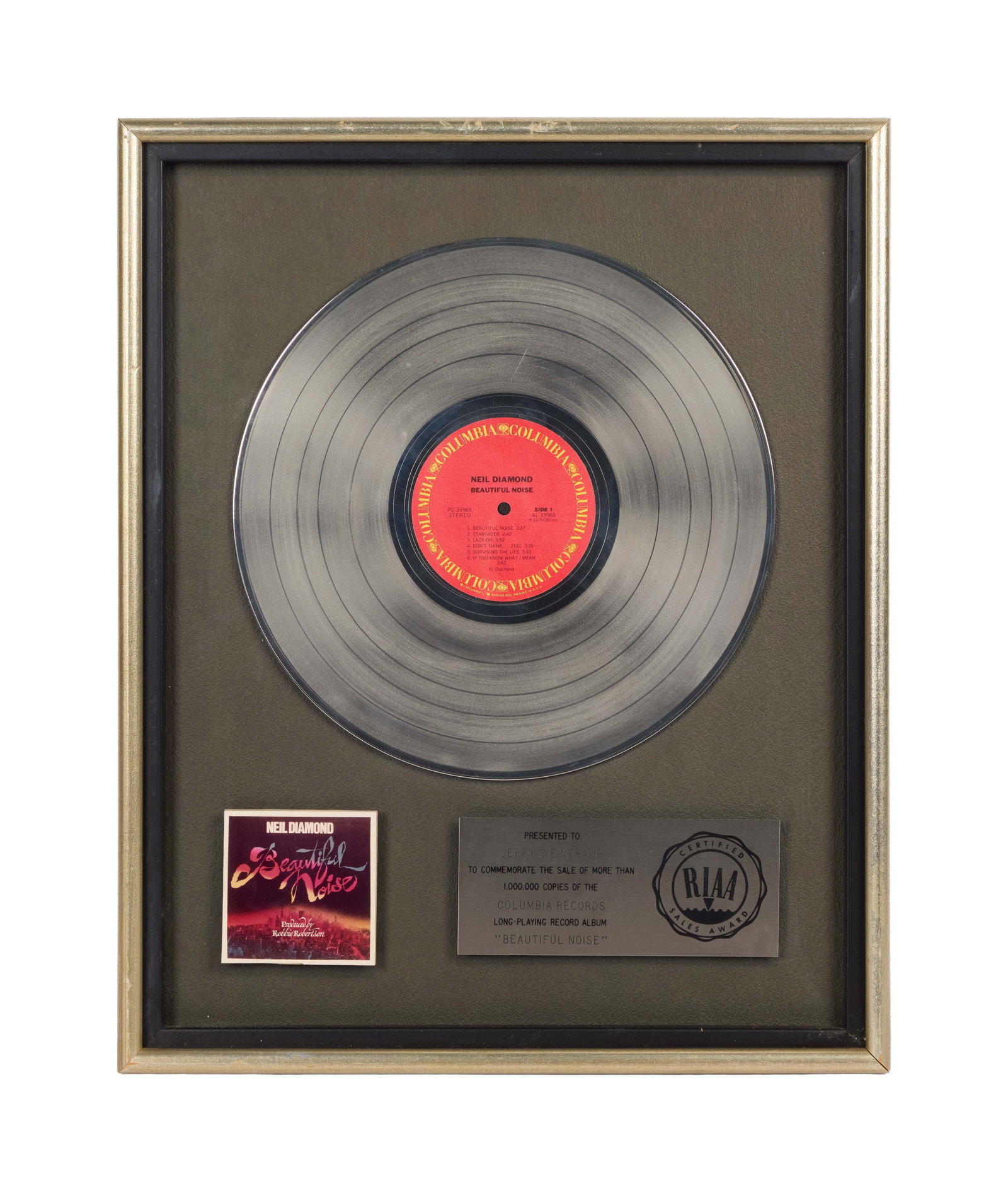 Neil Diamond | RIAA-Certified "Platinum" Sales Award for "Beautiful Noise" Presented to Jerry: An RIAA-Certified "Platinum" Sales Award presented to concert promoter and producer Jerry Weintraub to commemorate the sale of more than 1,000,000 copies of Neil Diamond's long-playing record
