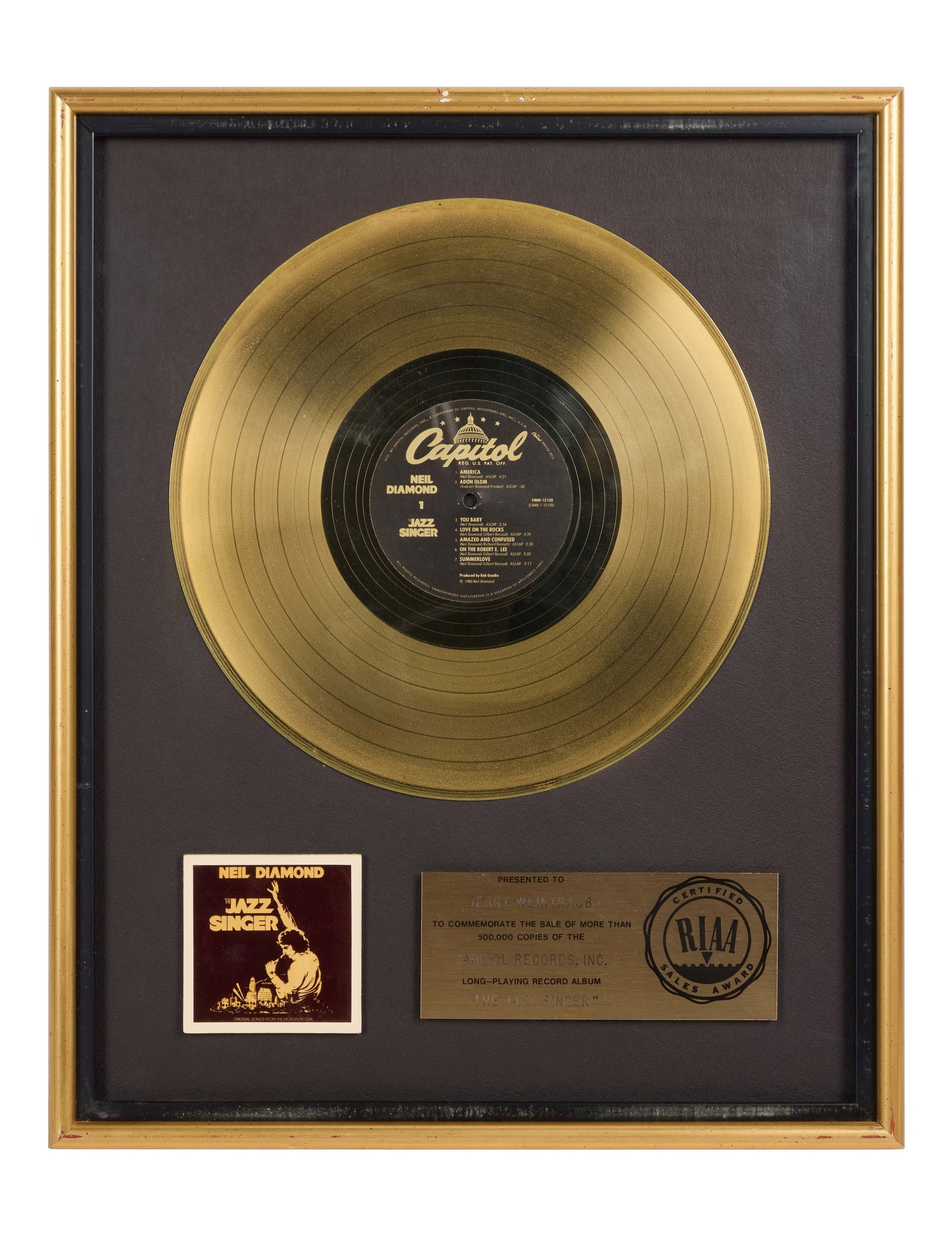 Neil Diamond | RIAA-Certified "Gold" Sales Award for "The Jazz Singer" Soundtrack Presented to Jerry: An RIAA-Certified "Gold" Sales Award presented to concert promoter and producer Jerry Weintraub to commemorate the sale of more than 500,000 copies of Neil Diamond's long-playing record album