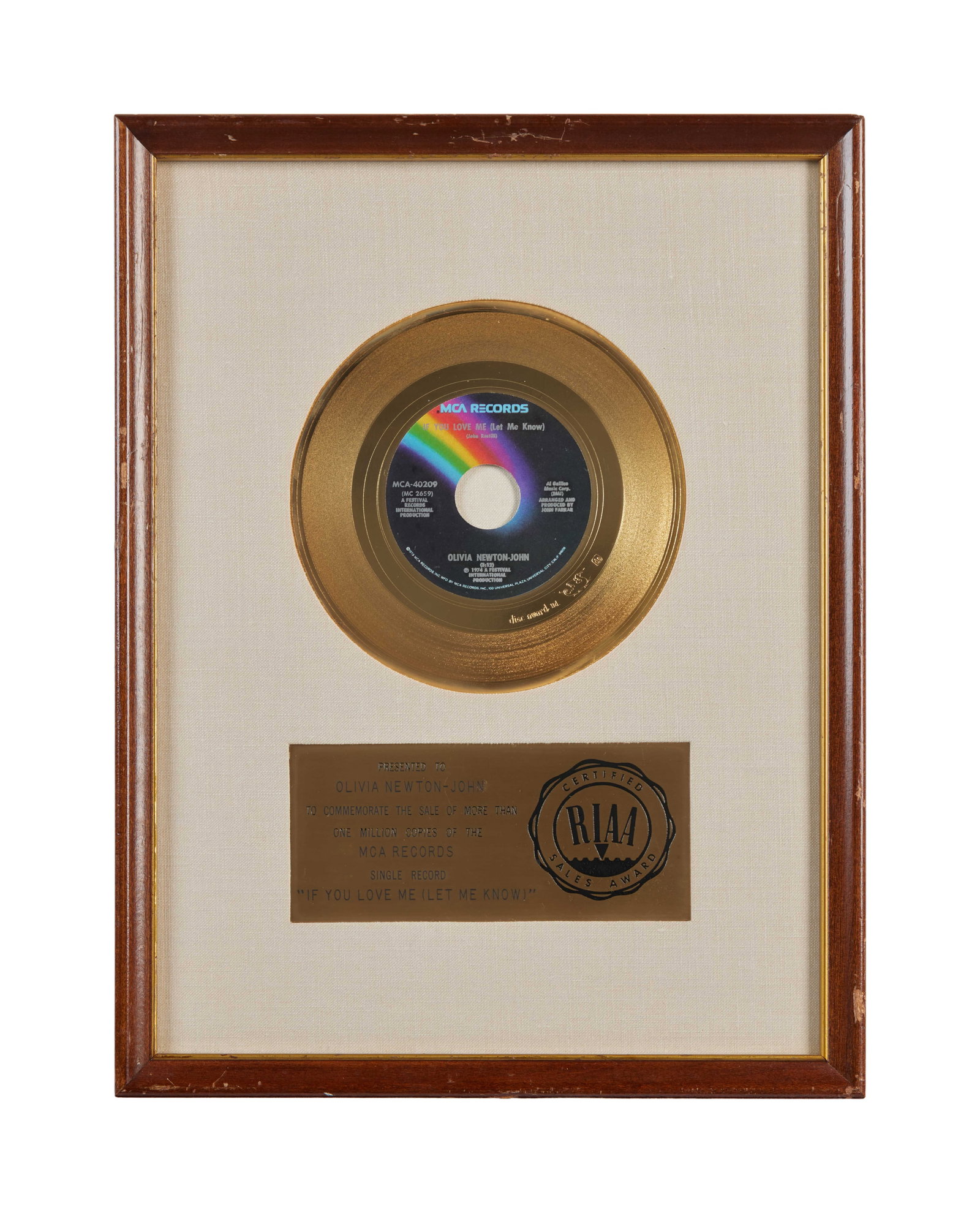 Olivia Newton-John | 1974 RIAA "Gold" Sales Award for "If You Love Me Let Me Know": An RIAA-certified "gold" record award presented to Olivia Newton-John to commemorate the sale of more than 1 million copies of the 1974 MCA Records single, "If You Love Me (Let Me Know)." Framed with