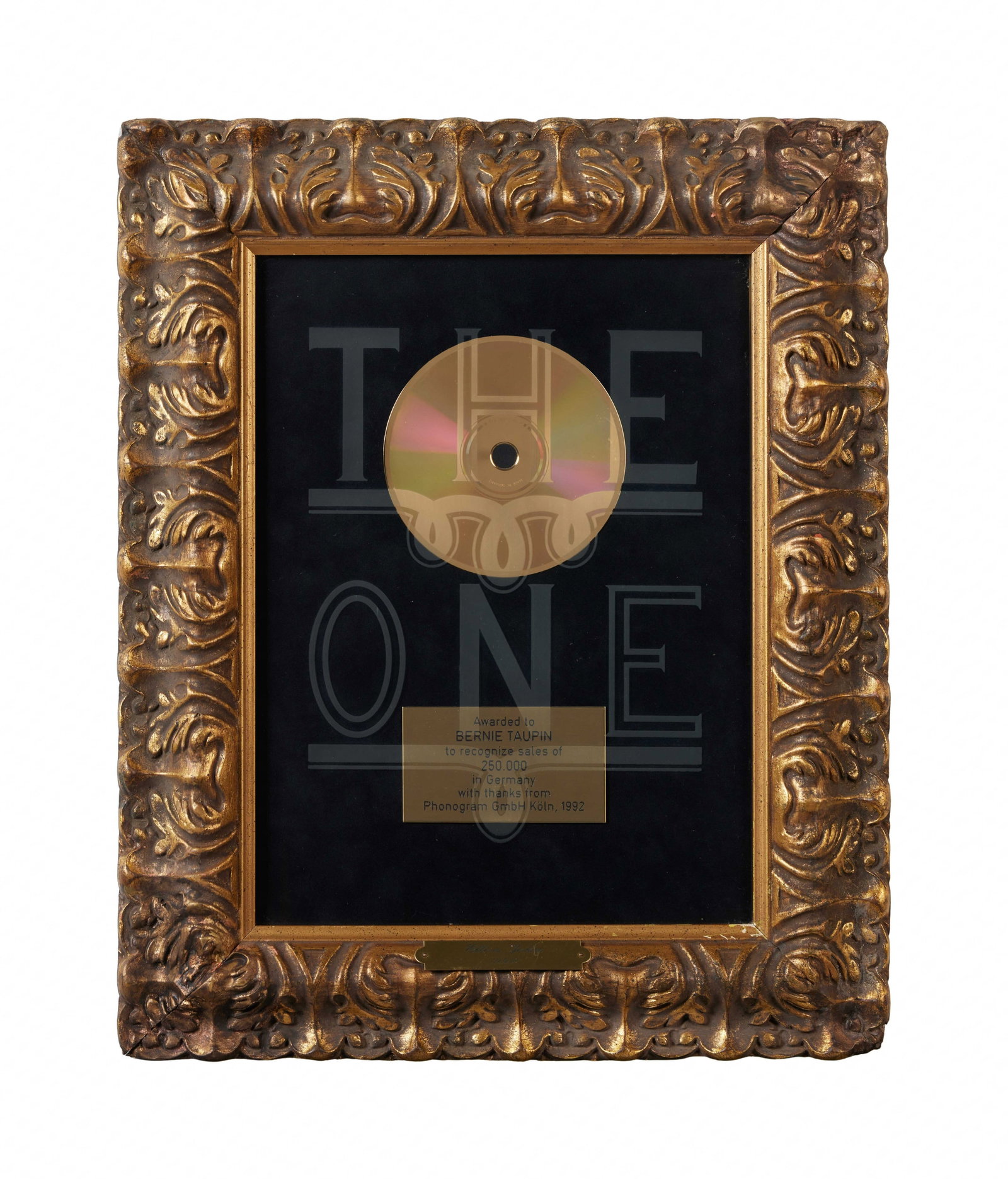Bernie Taupin | Elton John "The One" Record Award 1992: This is an award recognizing sales of 250,000 copies of Elton John's The One in Germany. Encased in an ornate gold frame. Bernie Taupin is a lyricist and artist who has co-written many of Elton 