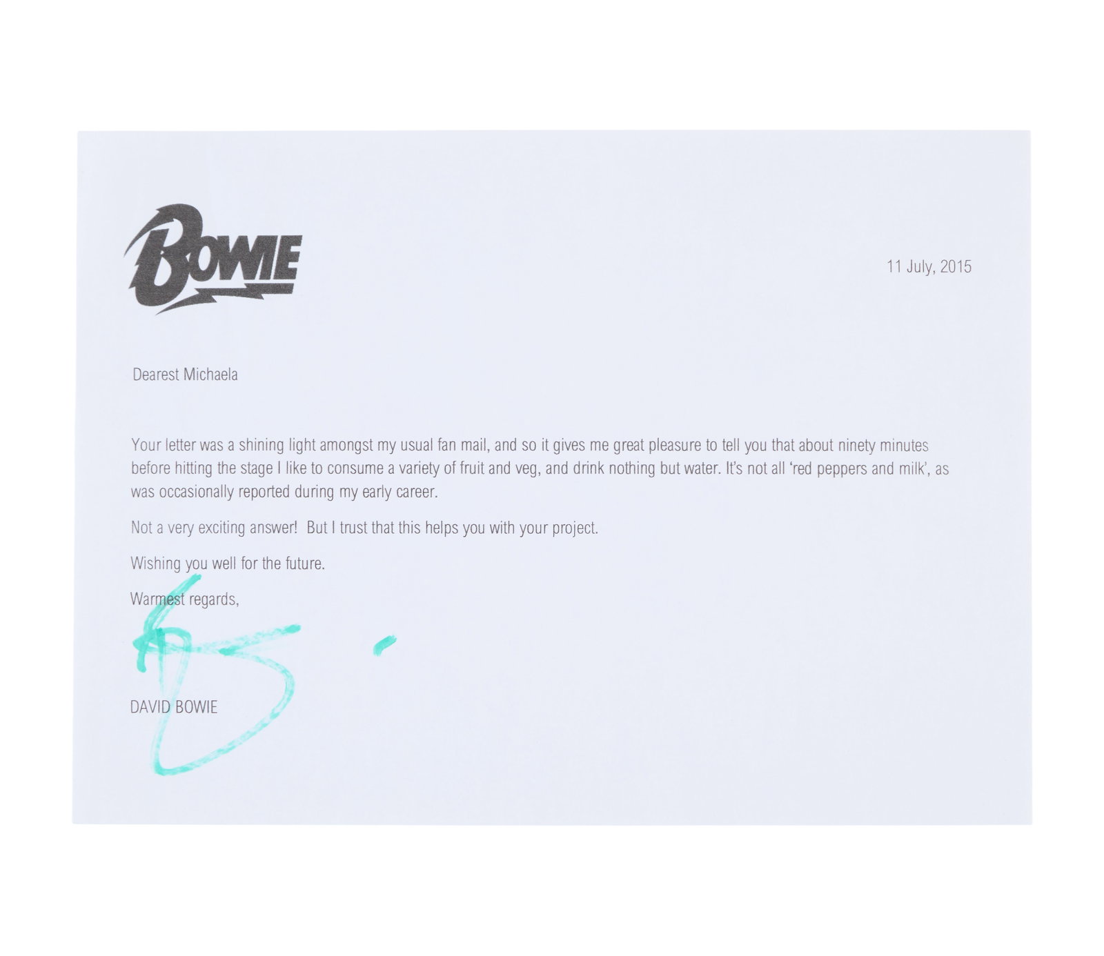 David Bowie | 2015 Signed Letter: A typed letter from David Bowie to a school child named "Michaela," signed by him in green marker. The letter addresses a question posed to him about what he eats before going on stage and is dated Ju