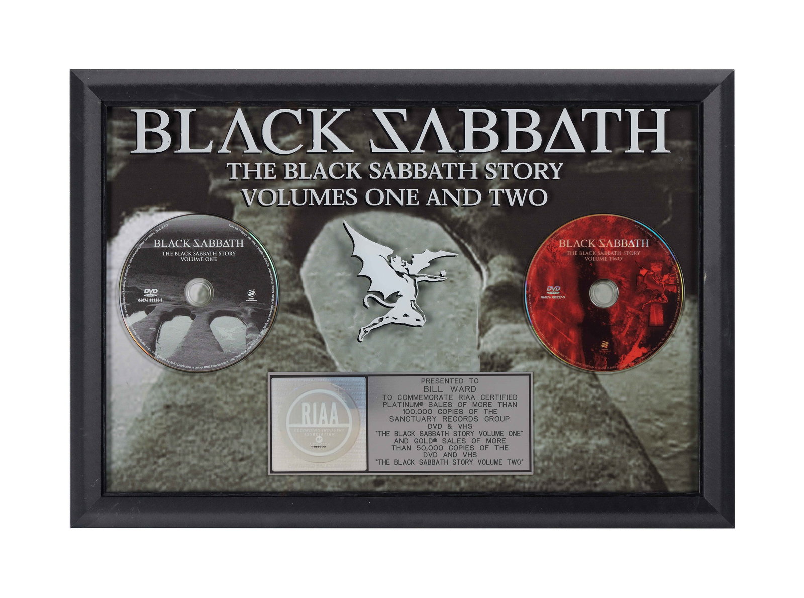 Black Sabbath | RIAA Sales Award for "The Black Sabbath Story Volumes 1 & 2" Presented to Bill Ward: An RIAA-certified "platinum" sales award presented to drummer Bill Ward to commemorate the sale of more than 100,000 DVD and VHS copies of The Black Sabbath Story Volume 1 and more than 50,000 DVD