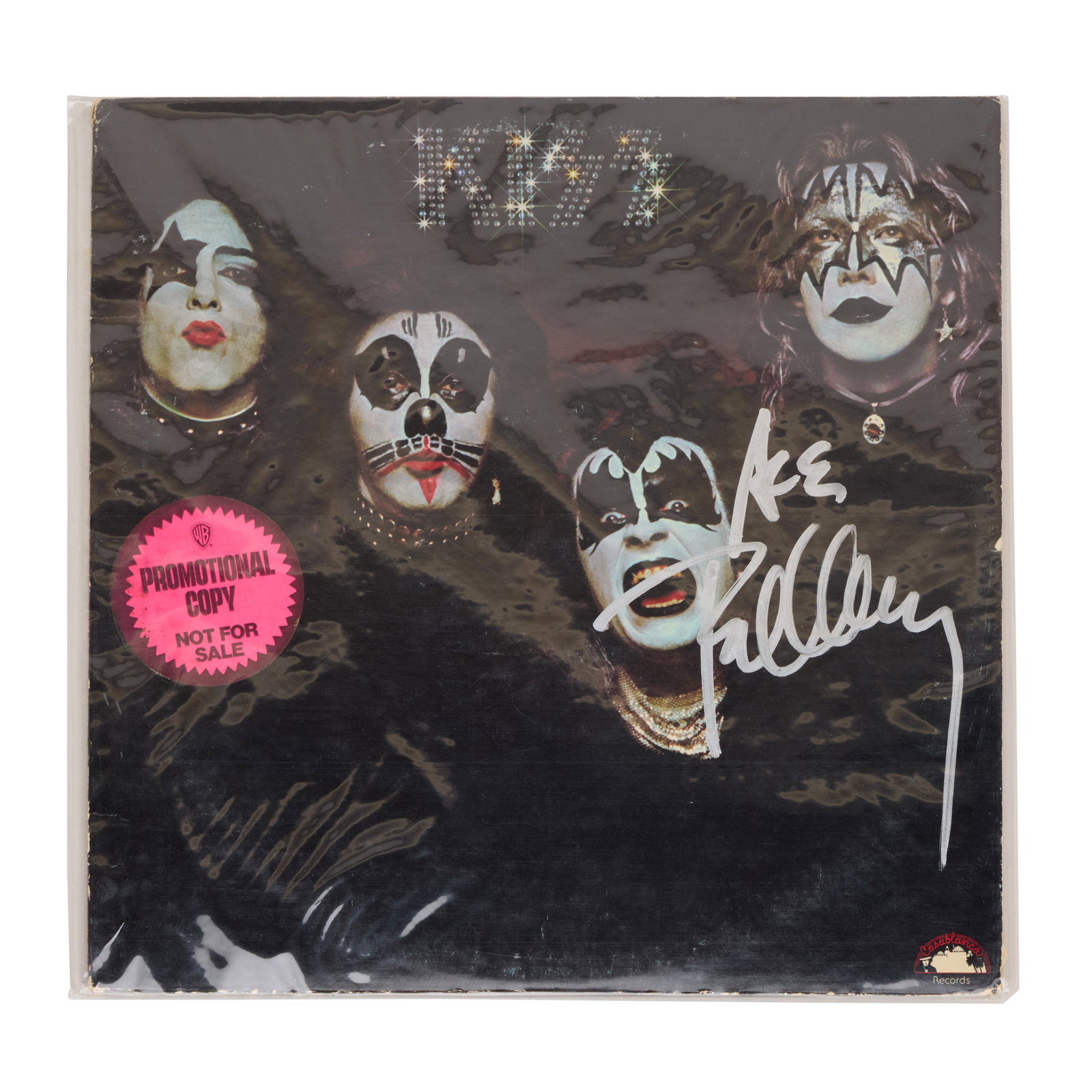 KISS | Ace Frehley Signed 1974 Promotional Copy Self-Titled Record Album: A promotional vinyl copy of the debut self-titled KISS album, released in 1974, signed in silver marker on the front cover by Ace Frehley. Sealed. The iconic cover features the four band members
