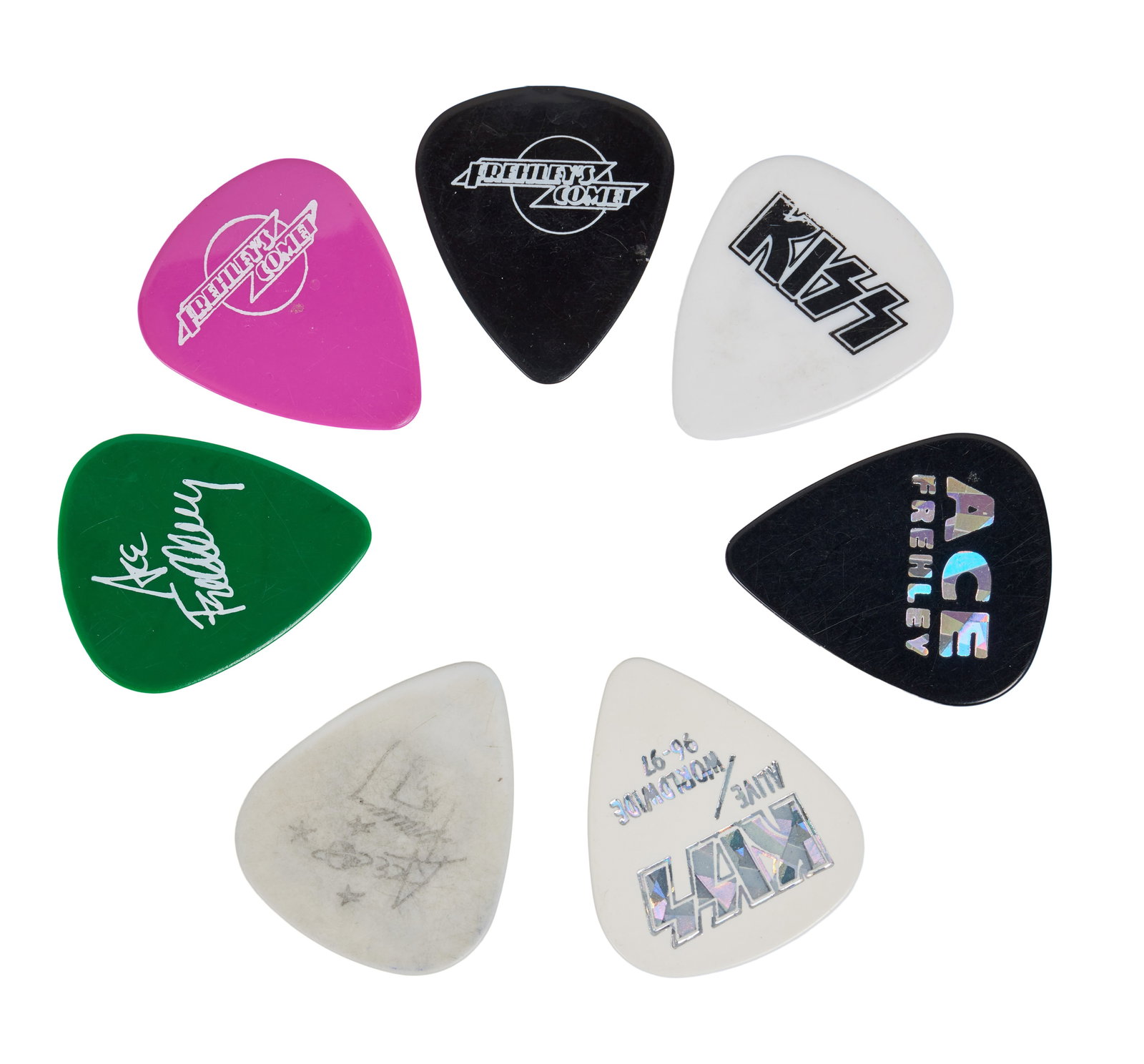 KISS | Ace Frehley Guitar Picks: A collection of 31 Ace Frehley guitar picks from various Kiss and Frehley's Comet tours. This lot includes three (3) Frehley's Comet picks in pink, green, and black; one (1) white pick with a KISS log