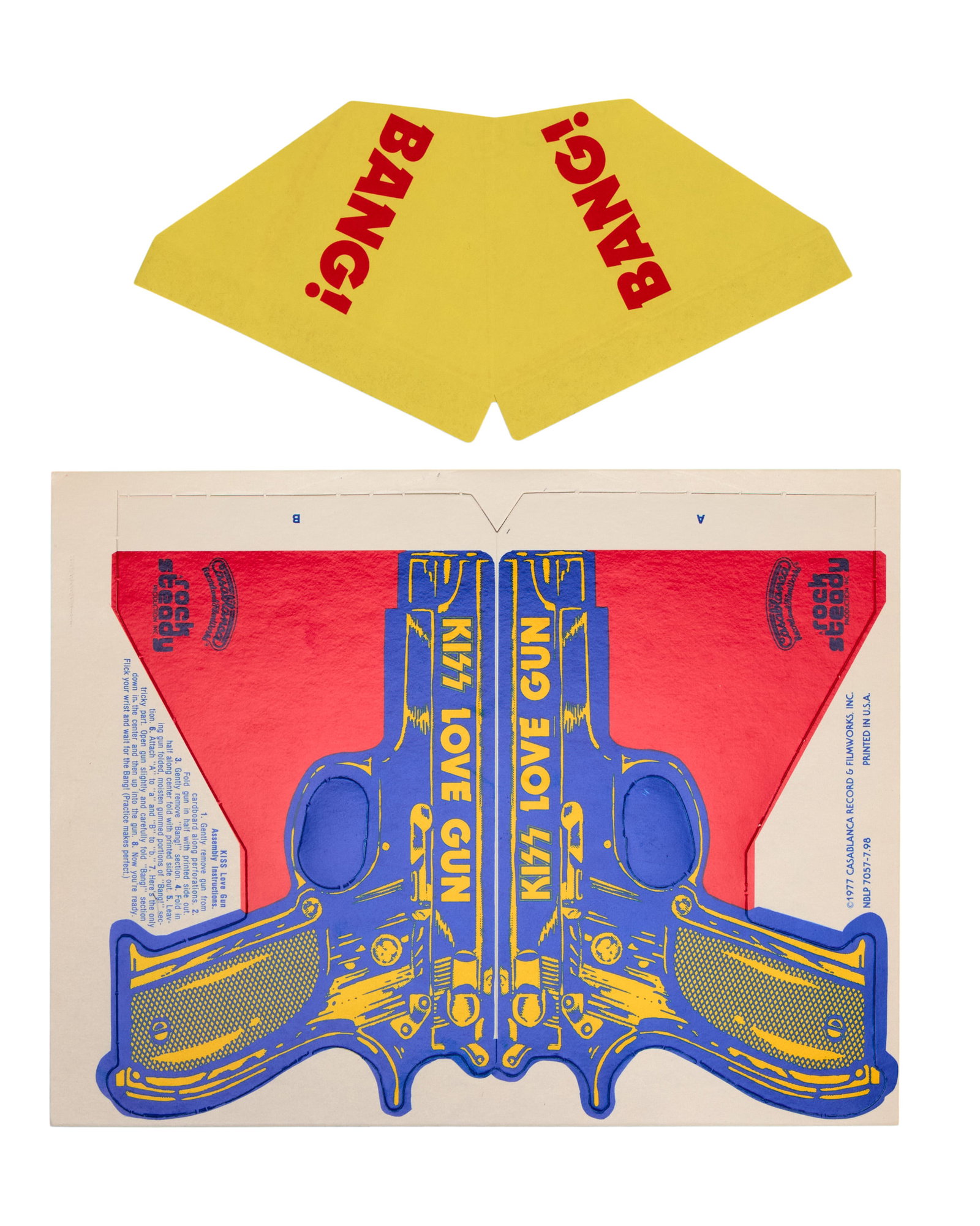 KISS | 1977 "Love Gun" Cardboard Gun Paper Toy: A 1977 KISS promotional die-cut cardstock "Love Gun." Unassembled, with assembly instructions typed on the front. The "Love Gun" was included in the original first pressings of the Love Gun viny